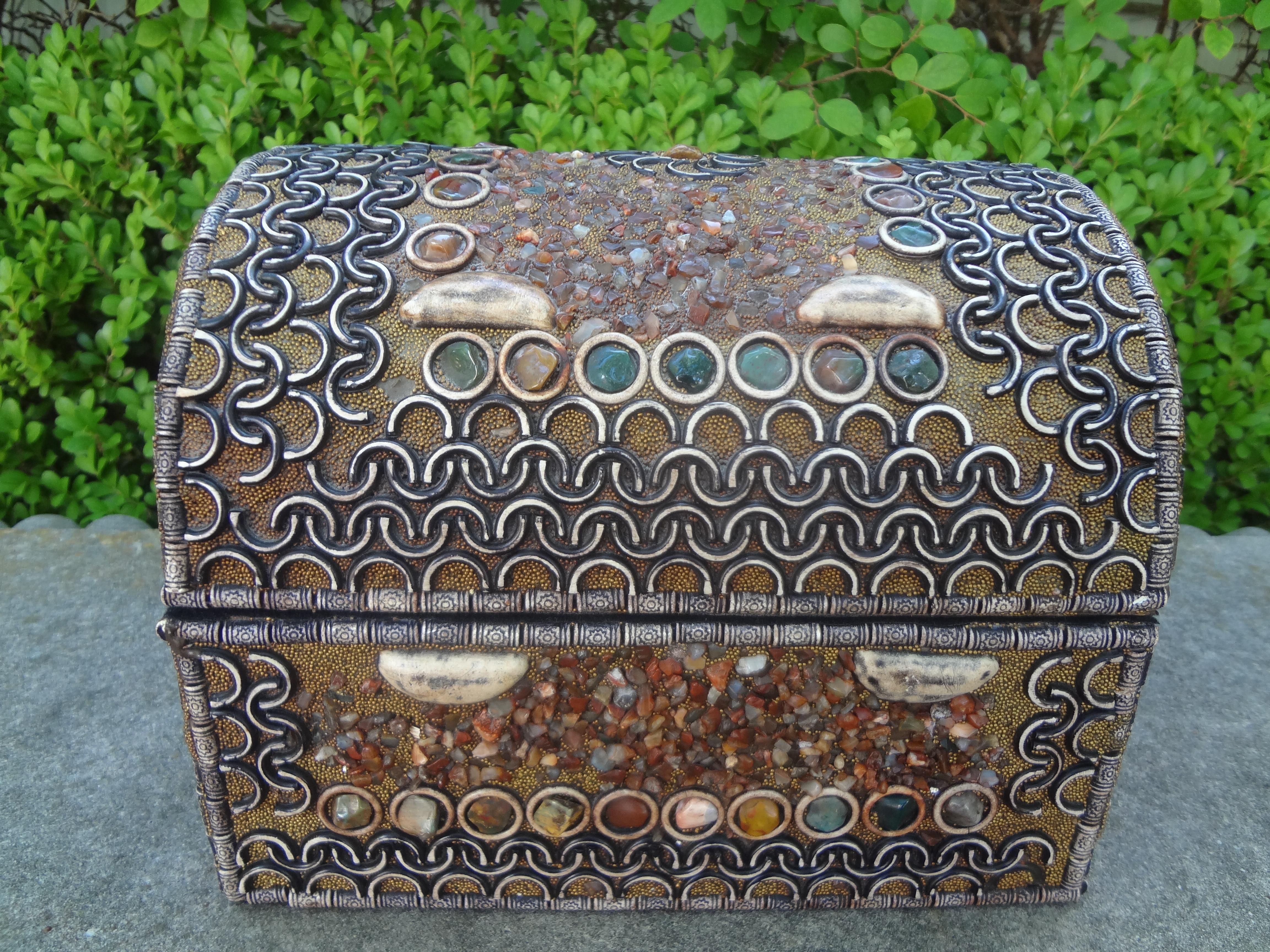Middle Eastern Agate encrusted decorative box. This Large silver middle eastern metal decorative box is encrusted with multi-colored agate stones in a variety of shapes and sizes. Our anglo-indian box, possibly from morocco makes a great coffee
