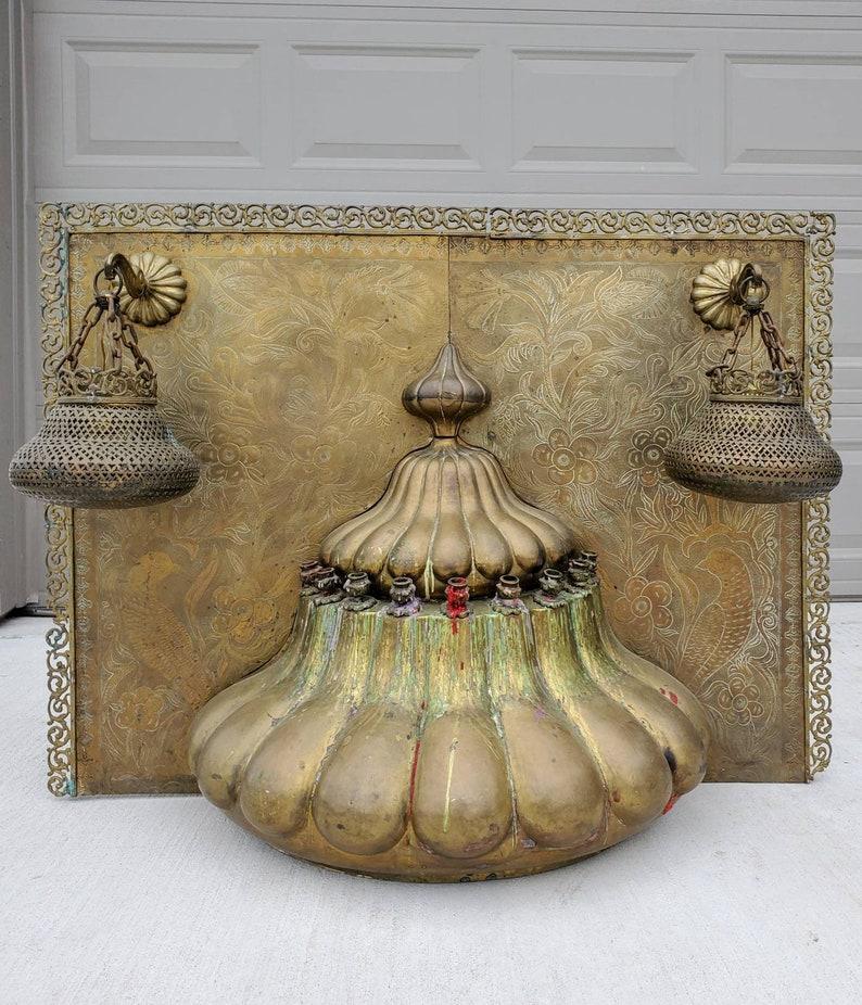 A magnificent, rare and unique Middle Eastern temple architectural shrine element, three lamp, possibly a fireplace overmantle, richly decorated, featuring ornate, intricately detailed incised brass floral, foliate and peacock bird background,