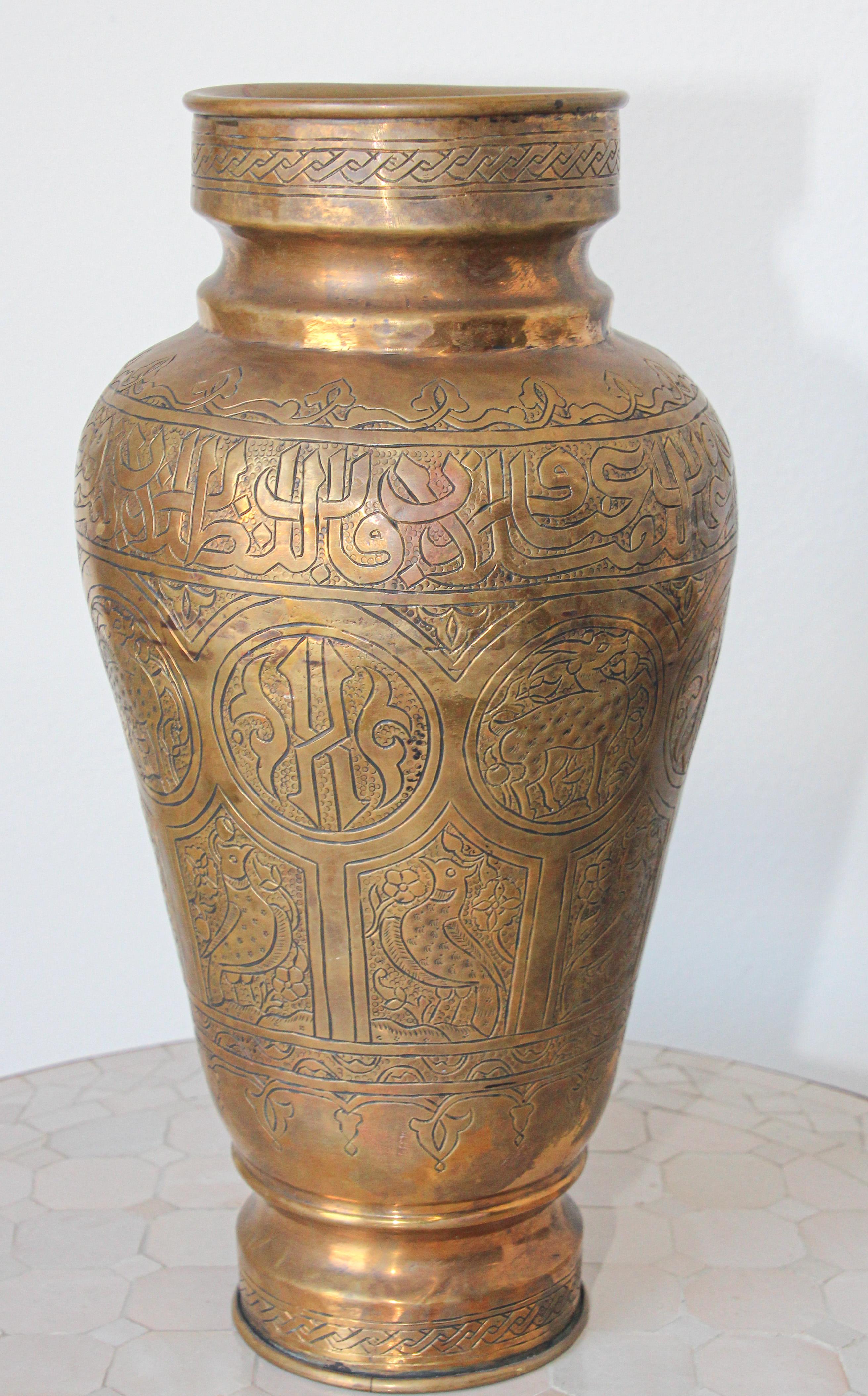 Middle Eastern Islamic brass repoussé vase, finely hand-etched, engraved, hammered and chased with elaborate Moorish Syrian designs decorated with medallions of Arabic calligraphy inscriptions and geometric designs and medallions with