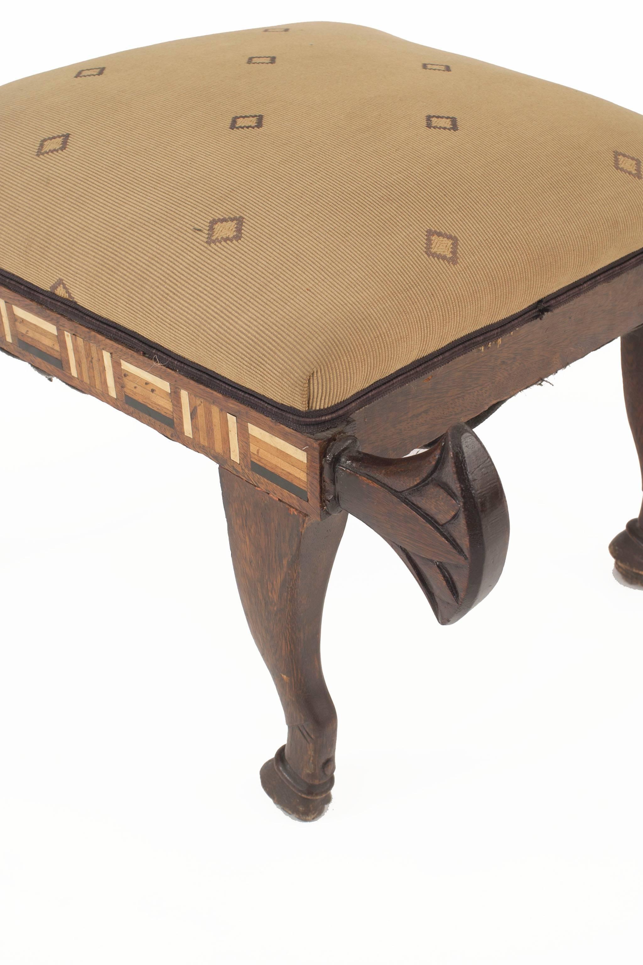 Middle Eastern Egyptian style (19th century English) mahogany bench with pearl, bone, and ebony trim and carved tails.
 