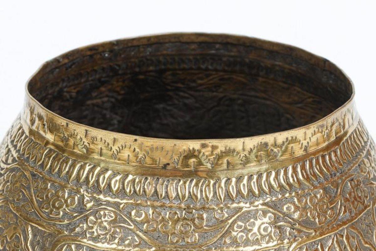 Large middle eastern Persian Islamic finely and heavily hand-etched and hand-carved brass decorated with Arabic inscriptions.
Could be used as a Jardiniere for a large orchids composition.
Engraved and hand-cut Arabic Islamic calligraphy and