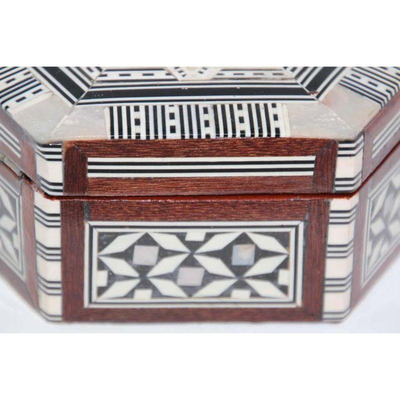 Exquisite handcrafted Middle Eastern mosaic marquetry inlaid walnut wood box. Small hexagonal box intricately decorated with Moorish motif designs which have been painstakingly inlaid. Great craftsmanship handmade by artisans. The interior is lined