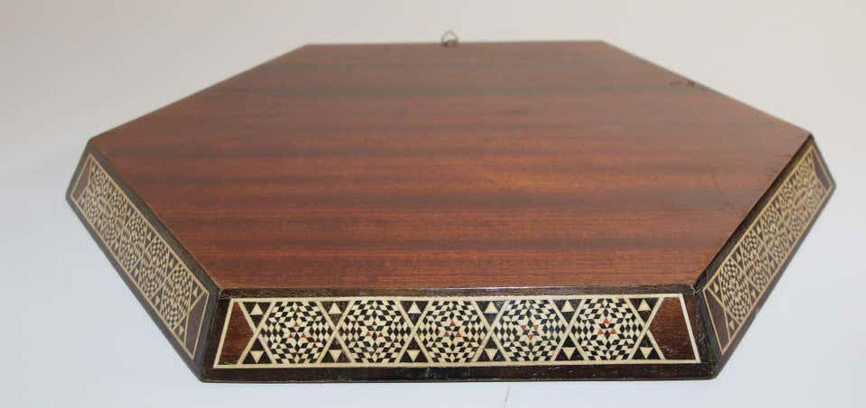 Middle Eastern Moorish inlaid with marquetry Mosaic octagonal tray.
Great inlaid micro Mosaic marquetry serving tray.
Displaying intricate mosaic inlay in geometric Moorish patterns,
circa 1950s
Size: 17.5
