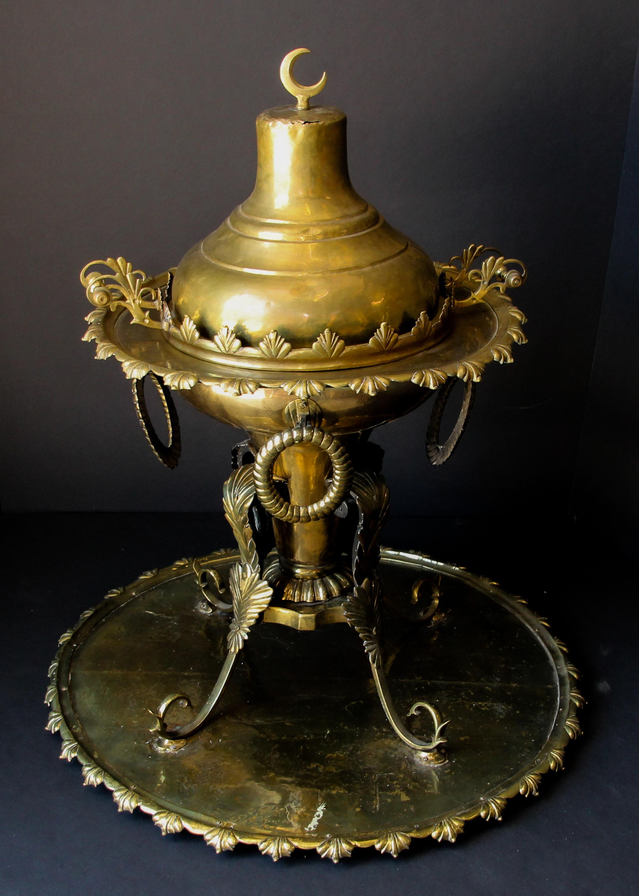Large antique 19th century Turkish incense burner or fire pit with pierced brass and solid brass ornamentation.
Museum quality Islamic collector metalwork piece footed incense censer.
Functional and beautifully adorned, rare to find complete with