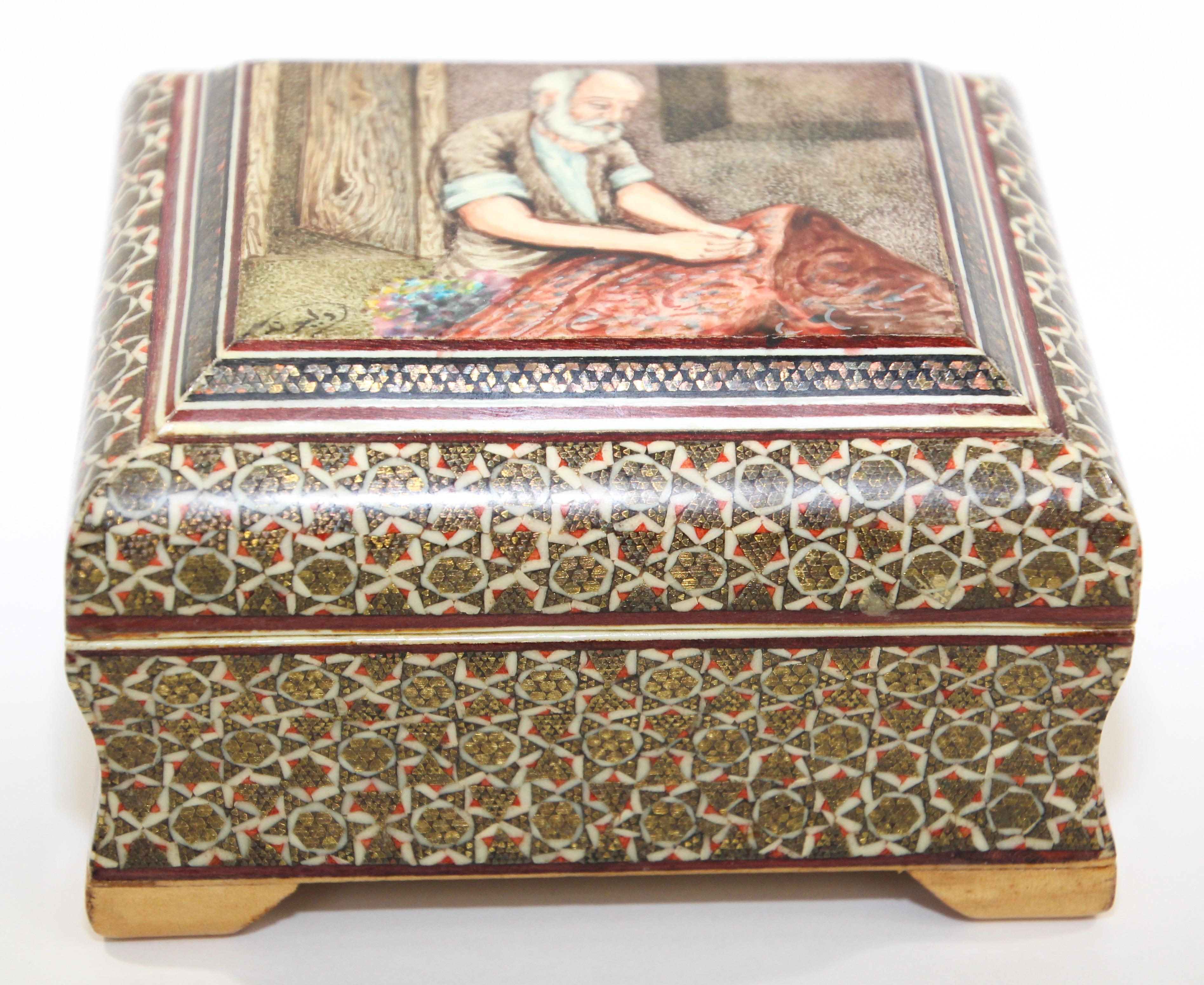 Exquisite handcrafted Middle Eastern mosaic marquetry inlaid wood box.
Small octagonal box intricately decorated with a miniature painting of an old man with a textile in his hand motif and inlaid with mosaic marquetry.
Middle Eastern, Asian micro