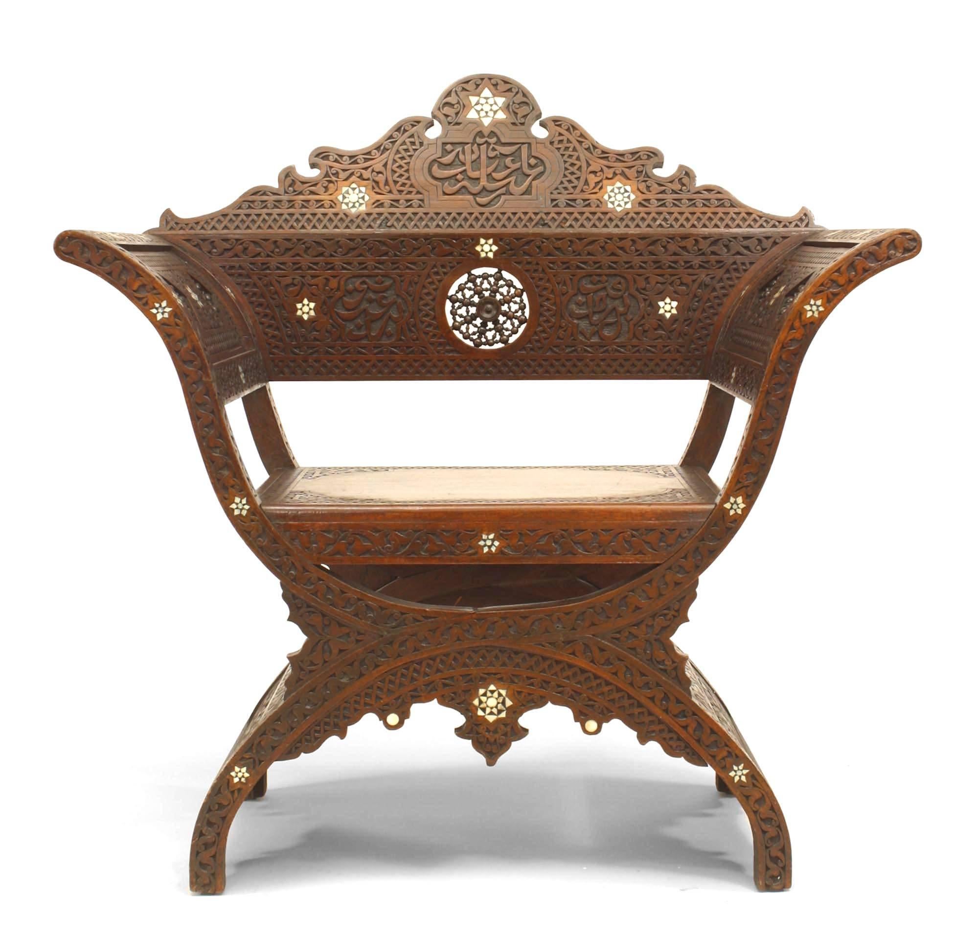 Middle Eastern Moorish (19th Century) carved walnut Savonarola style armchair with a spindle and ball round back panel.
