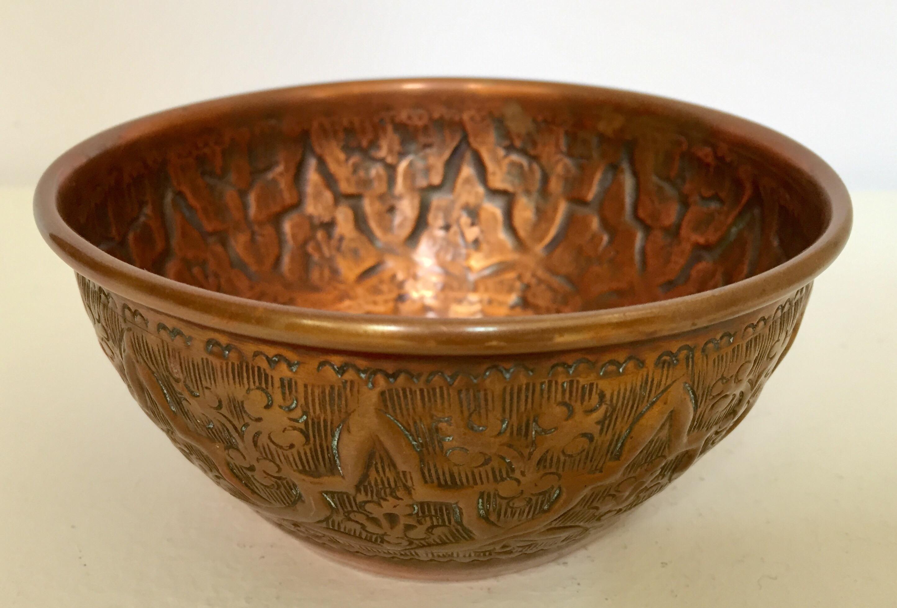 Middle Eastern copper bowl etched and embossed with floral and geometric Moorish designs.
Used for ceremonial celebration offering and wedding to share milk between the groom and bride.
Decorative ceremonial brass copper repousse bowl.
Measures: