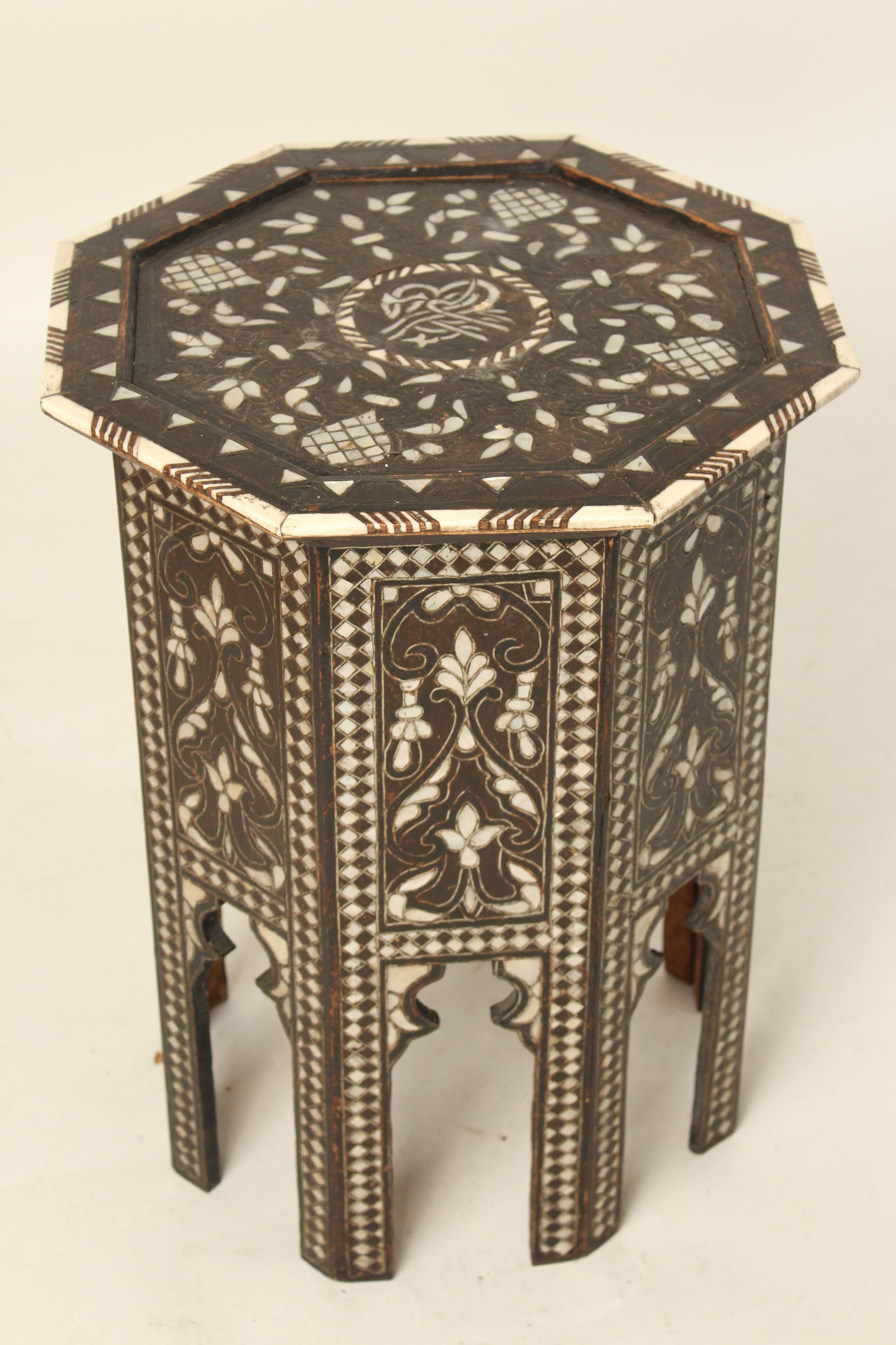 Middle Eastern mother of pearl and bone inlaid octagonal shaped occasional table, circa 1950.