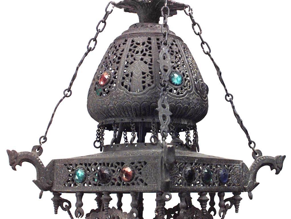 Middle Eastern Persian (19th Century) iron filigree and brass trimmed chandelier with 6 dragon design arms with glass jewels and stained glass panels
