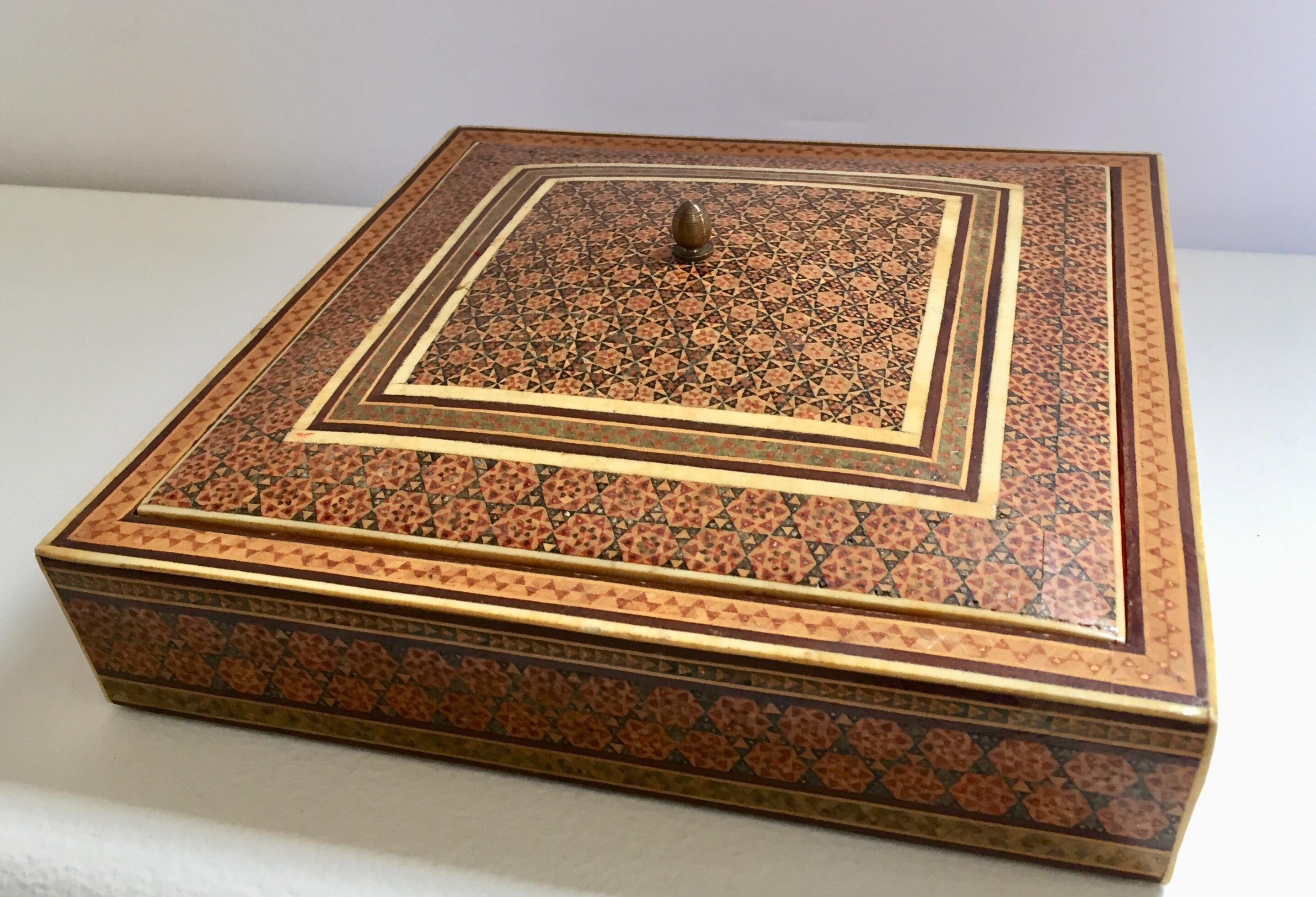 Fine Persian Sadeli micro mosaic inlaid jewelry box with lid.
Intricate inlaid Middle Eastern Persian box with floral and geometric Islamic Moorish design in a rectangular form.
Moorish design bone inlay and marquetry, very fine artwork, lined in
