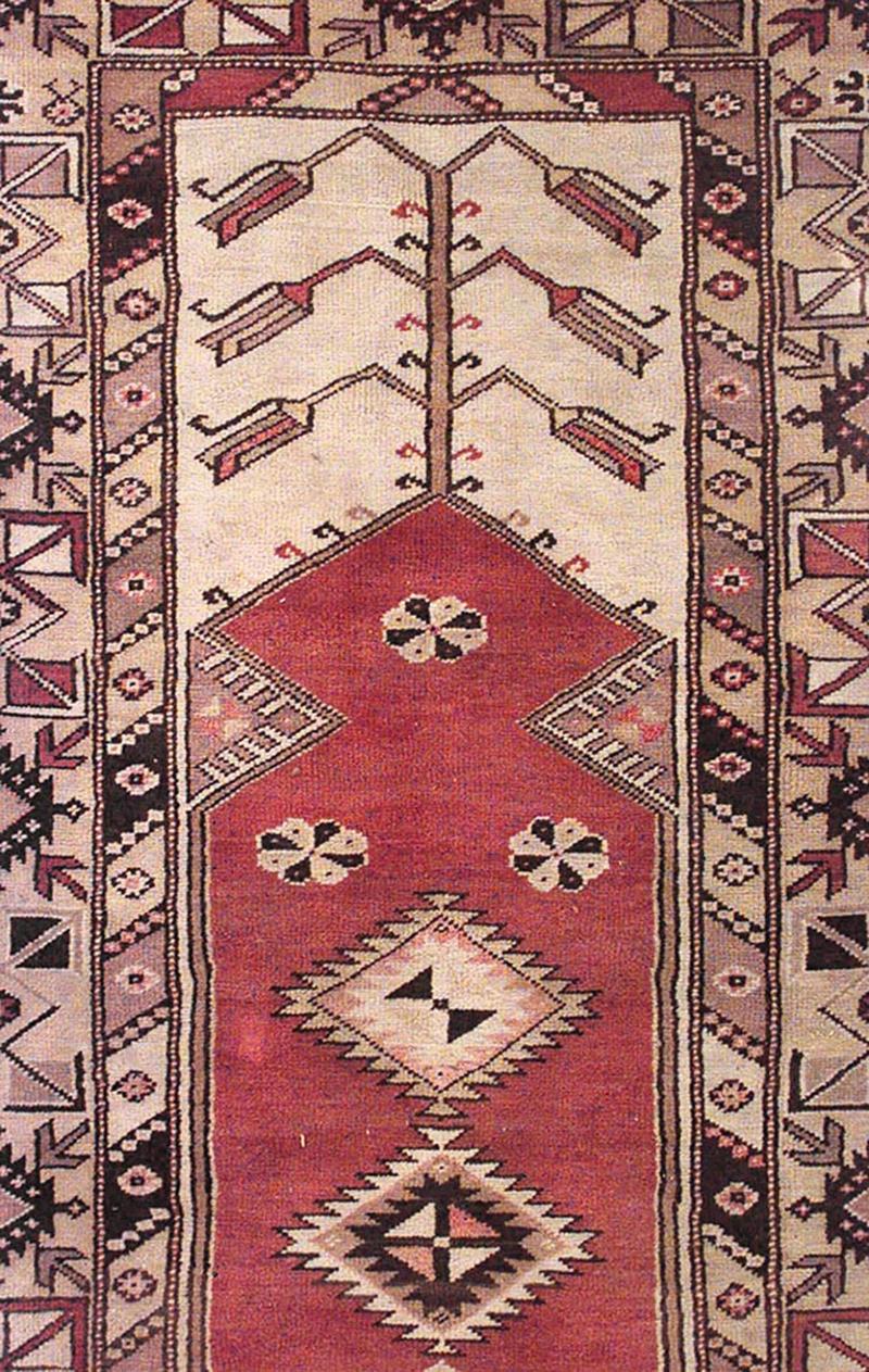 Middle Eastern Persian tribal style wool prayer rug carpet with geometric tree-of-life design and rust-red field (7 x 4').

Please note: used/antique condition
