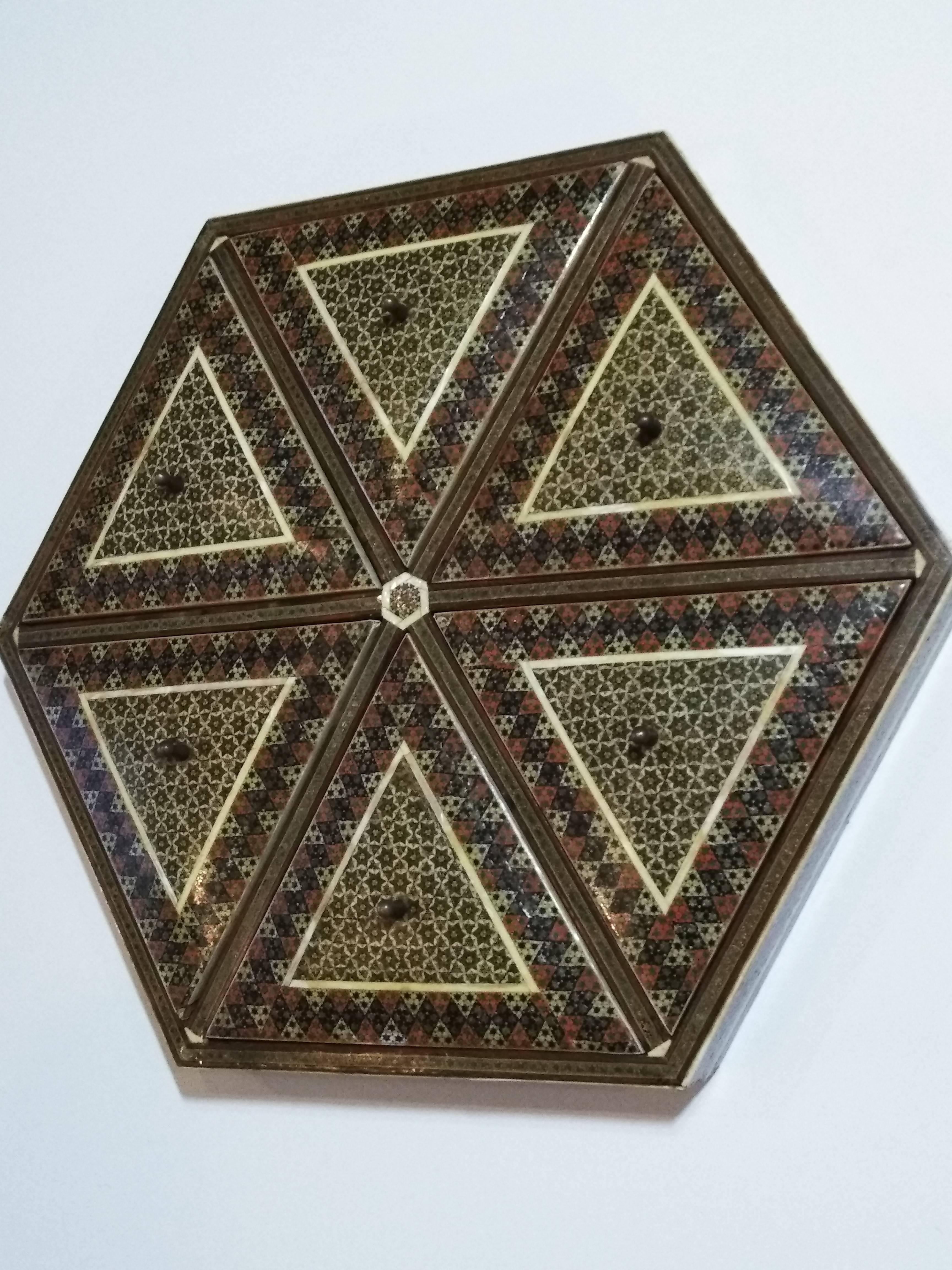 Exquisite jewelry box, intricate inlay with Moorish motif design which is made of inlay with bone, wood, silver and copper thread.

Interior is lined with antique red velvet with glass bottom. Each top has a brass nob.