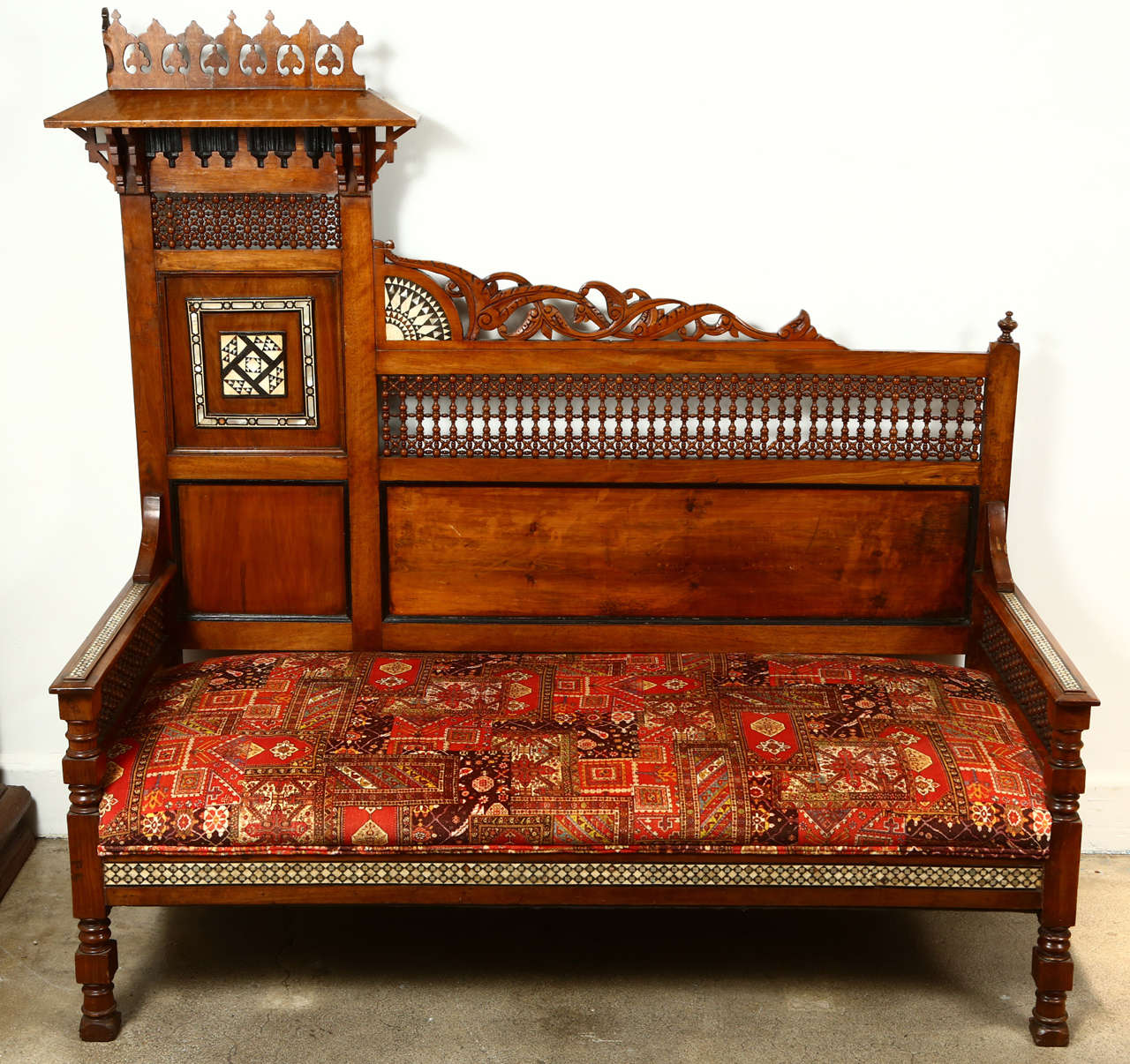 19th century Middle Eastern Turkish settee, intricate Moroccan Musharabie Moorish fretwork on the back and side, inlaid mosaic marquetry.
Hispano Moresque Ottoman style very unusual shape decorative sofa.
Upholstered with a fabric that looks like a