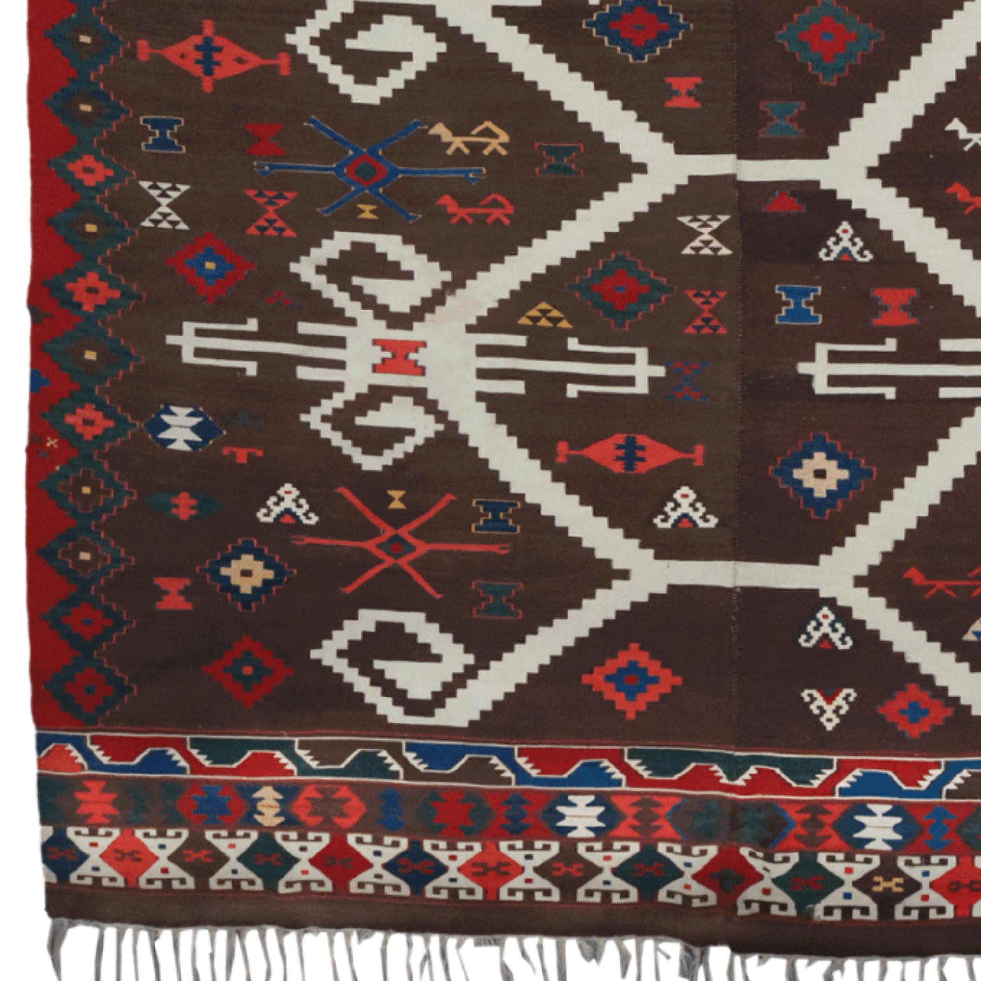 A unique representative of Anatolia's weaving tradition, this mid-19th century antique Sivas rug is dazzlingly valuable for history and art enthusiasts. Adorned with traditional Turkish motifs, the rug has a striking appearance with its masterfully