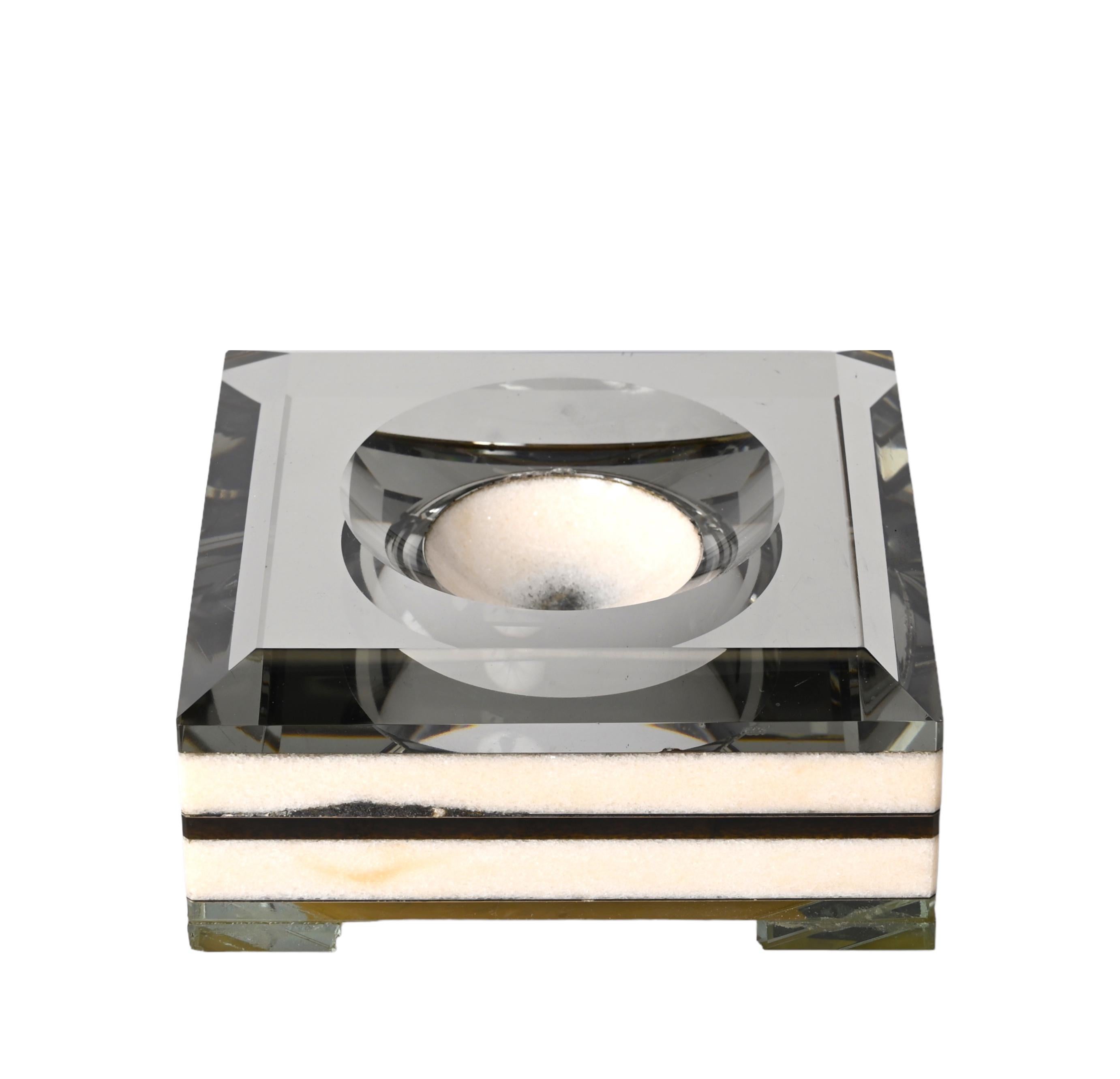 Elegant midcentury marble and mirrored top ashtray. This fantastic piece was designed in Italy during the 1970s.

Italian designers inspire this wonderful piece from the 1970s for materials (marble, mirror). Its pure and simple lines and the way