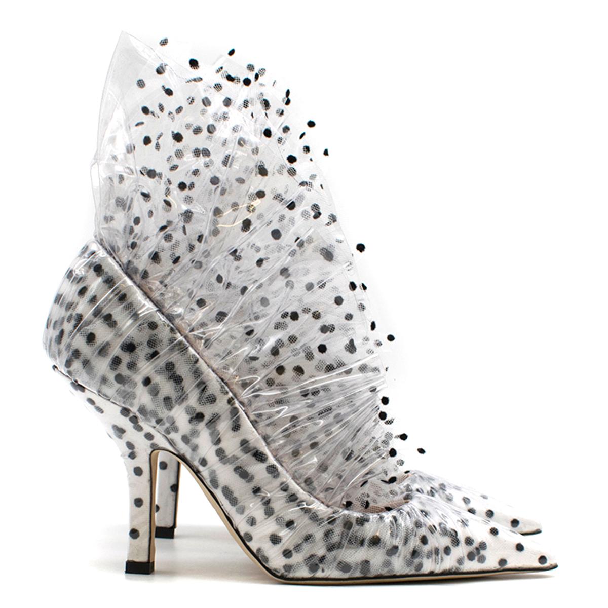 Midnight 00 White Polka Dot Tulle & PVC Pump

- White tulle & PVC pump
- Black polka dot
- Ruffled tulle & PVC around the ankle
- Pointed toe
- 90mm stiletto heel
- Nude leather lining with logo embroidered
- This item comes with the original dust