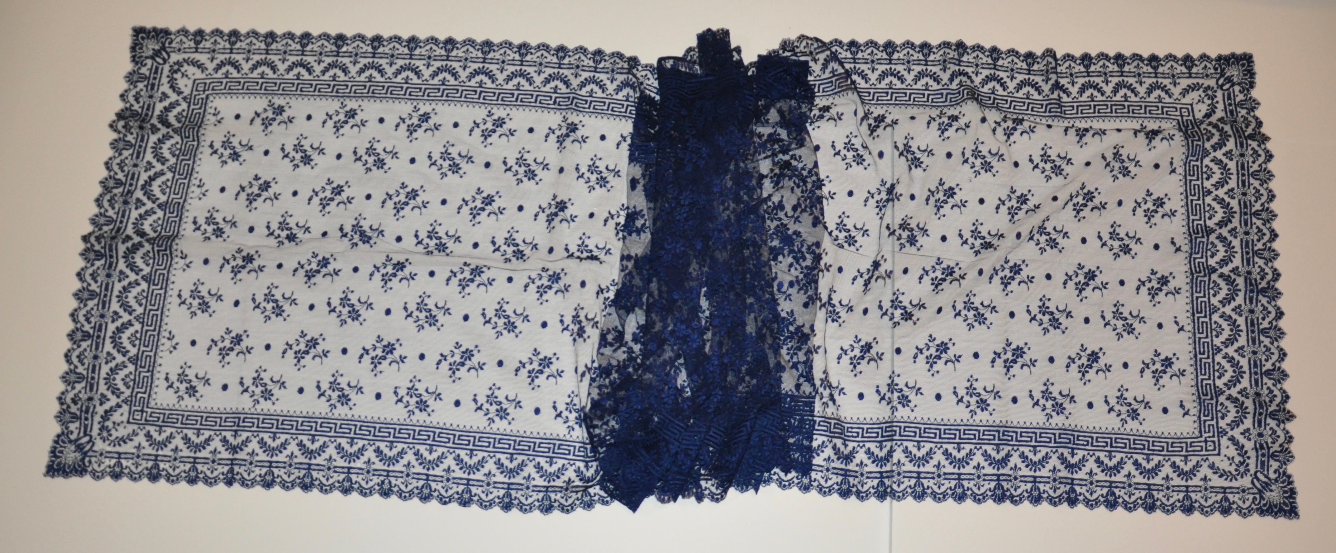       This wonderfully elegant hand-woven midnight blue french lace floral accented with scallop edges, measures 105 inches in length by 23 inches in width. There are a few minor micro holes but barely noticeable. Hand-woven in France. Made in