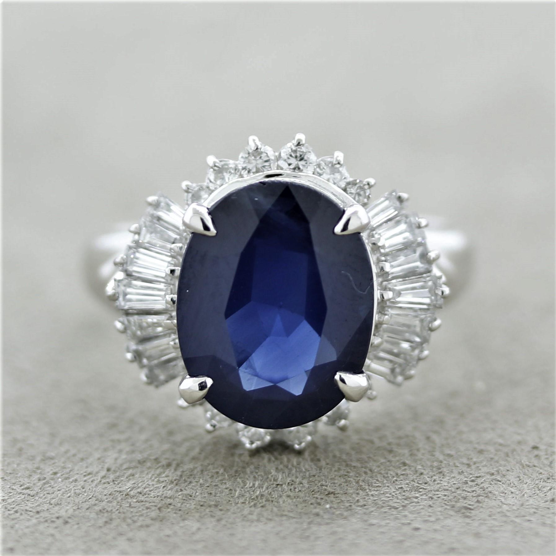 An elegant platinum ring featuring an oval shape sapphire weighing 6.02 carats with a rich midnight blue color. It is complemented by 0.78 carats of round brilliant-cut and baguette-cut diamonds set around the sapphire in a stylish pattern.