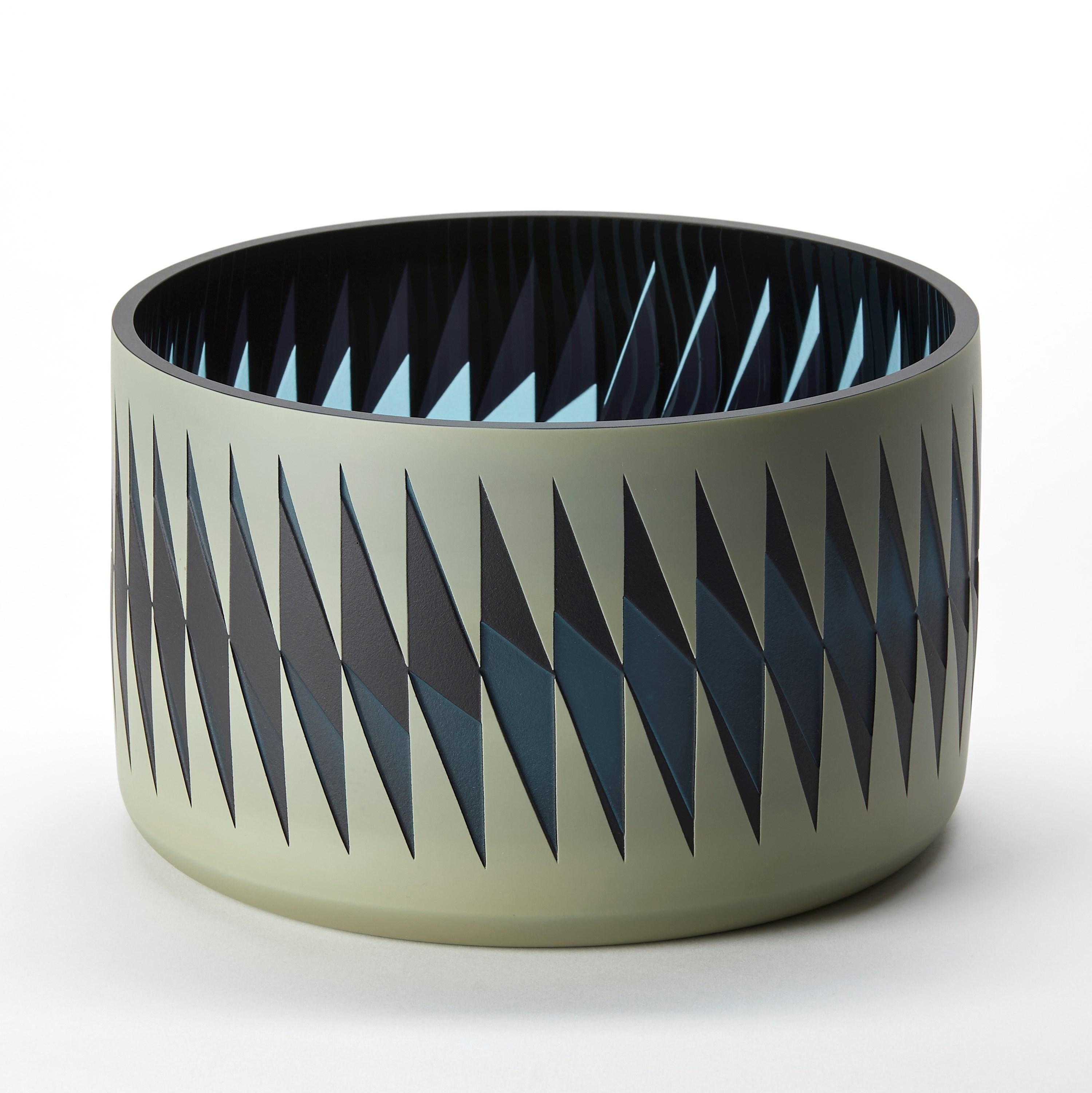‘Midnight Blues' is a unique glass sculptural vessel by the British artist, Sarah Wiberley. Handblown from layers of colour, the precise patterns shown are created by masking and sandblasting different areas, with each configuration revealing a