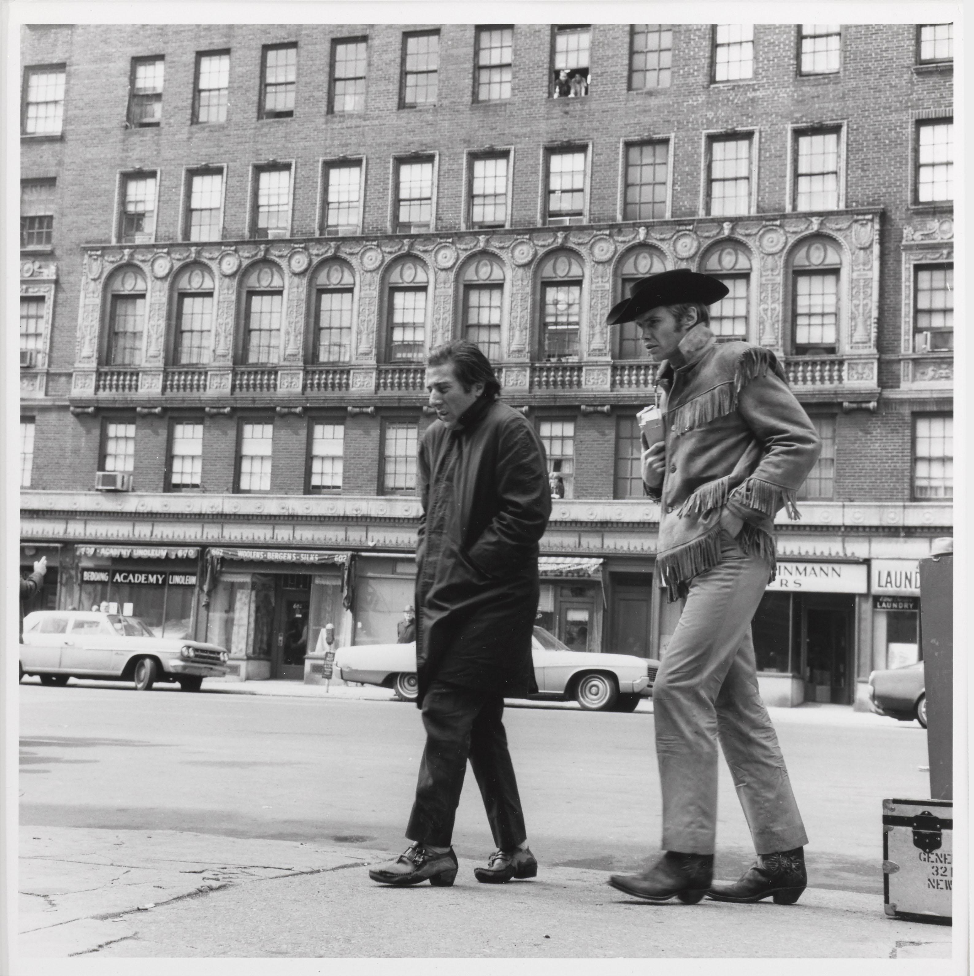 Original American photographic production still for the 1969 drama film Midnight Cowboy.
This film was directed by John Schlesinger and starredDustin Hoffman, Jon Voight.
This piece is framed in a Sapele wood frame with acid free card mounts and UV