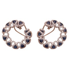 Boucles d'oreilles halo de saphirs bleus en or 14 carats