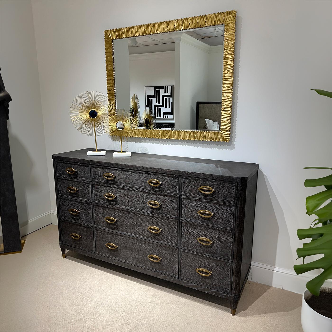 Midnight Modern Dresser, a fine 12-drawer modern dresser with a dark cerused Midnight finish, the 12 drawers designed with three rows of graduated sizes. With cast brass modern oval handles, raised on square tapered legs with brass