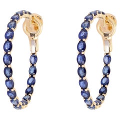 Pendientes de aro de oro de 14K con zafiros azules ovalados de 8,12 ct en total