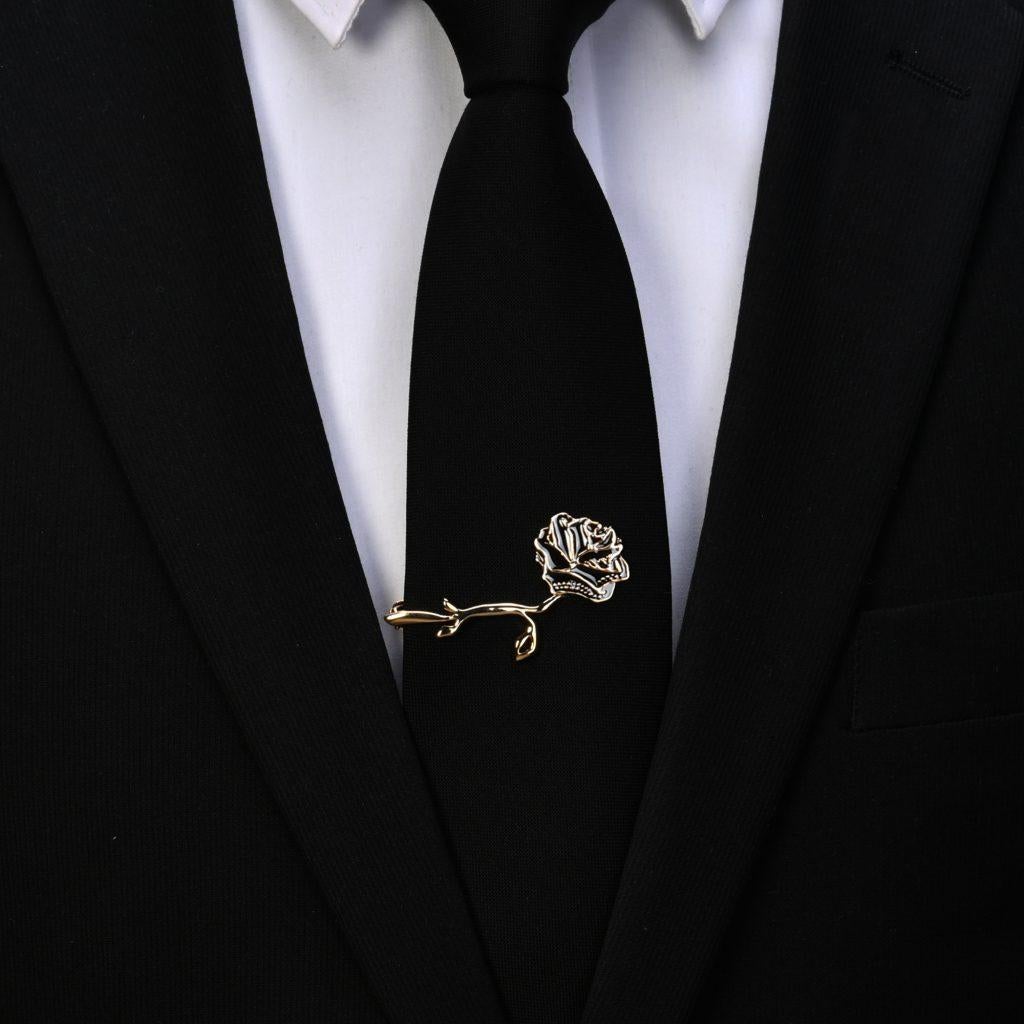 Full of passion and mystery, our Midnight Promise Eternal Tie Clip is an enchanting treasure. The striking contrast of gold trim accents with dark midnight petals delightfully enhance the beauty of this hand-crafted floral keepsake. Your special