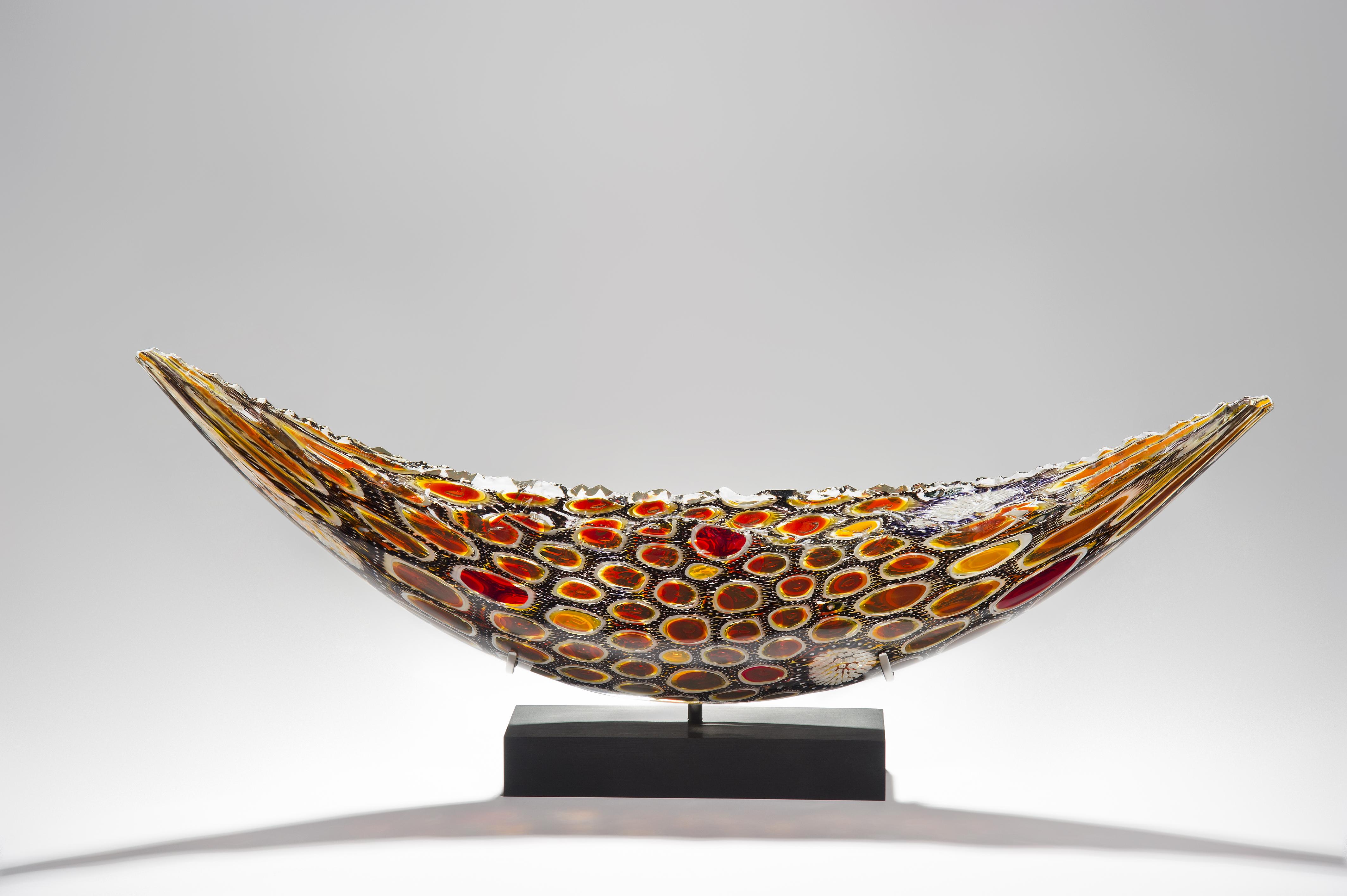 Midnight Quillon is a unique solid glass sculpture made in collaboration between the British artist James Devereux and the American artist David Patchen. Patchen's work is known for its intense colors, intricate detail and meticulous craftsmanship.