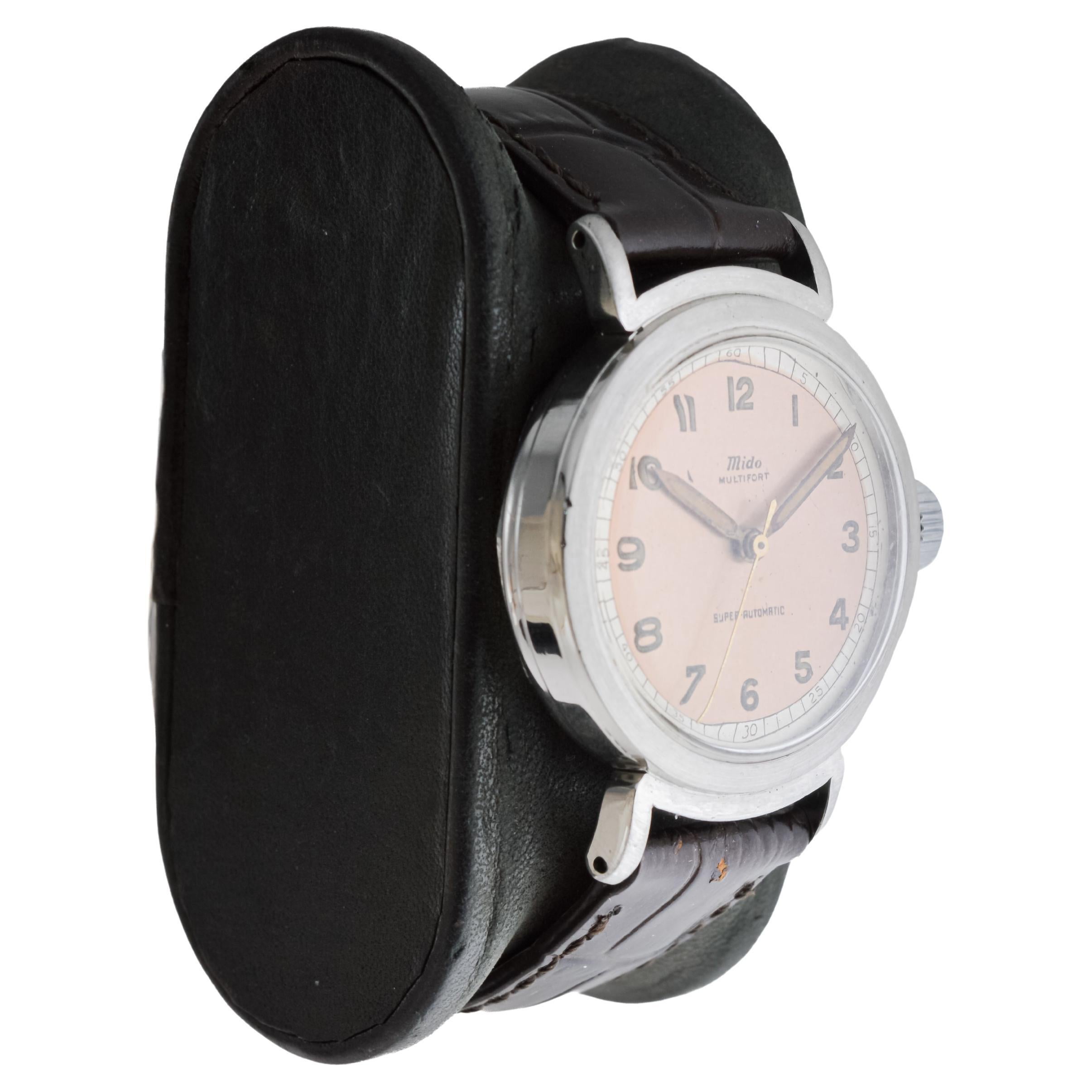 FACTORY / HOUSE: Mido Watch Company
STYLE / REFERENCE: Multifort / British Patents
METAL / MATERIAL: Stainless Steel
CIRCA / YEAR: 1940's
DIMENSIONS / SIZE: Length 39mm X Diameter 33mm
MOVEMENT / CALIBER: Manual Winding / 17 Jewels / Caliber Bumper