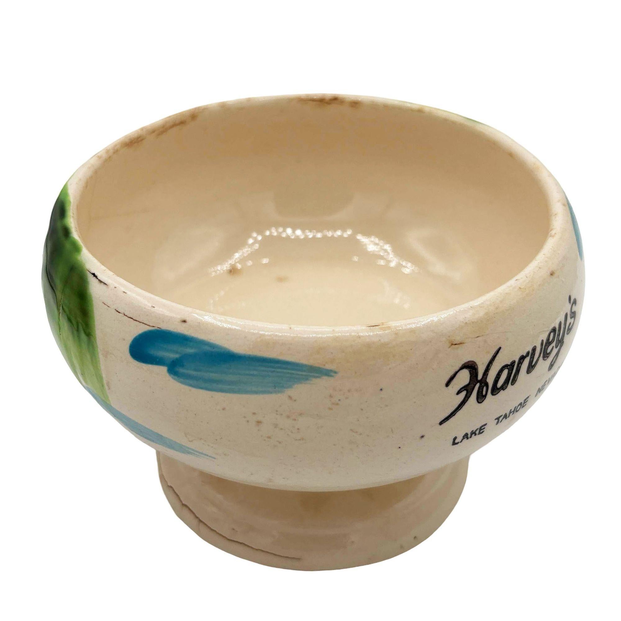 Original 1950s Harveys Lake Tahoe tropical hula Scorpion bowl/mug. The ceramic mug was hand-painted in Japan and features a Hula Scorpion design that captures the essence of the Hawaiian culture.

The mug is in good condition and has a crack along