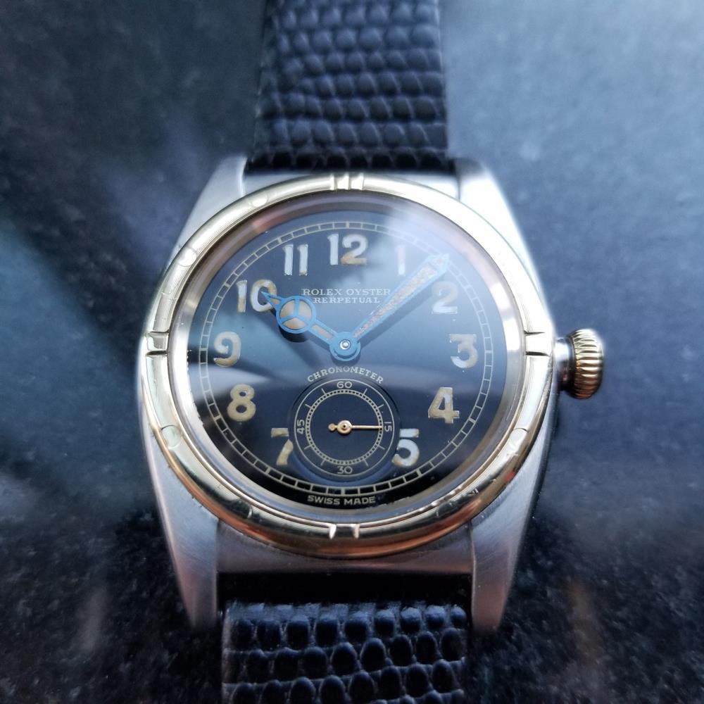 Timeless classic, men's 14k gold and stainless steel Rolex Oyster Perpetual ref.3372 bubble back automatic, c.1944. Verified authentic by a master watchmaker. Gorgeous vintage Rolex signed black dial, Arabic numeral hour markers, Mercedes minute and