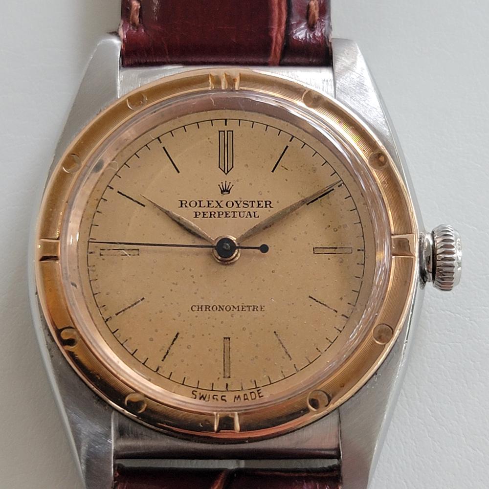 A rare timeless classic, Men's 18k rose gold & stainless steel Rolex ref.2940 Oyster Perpetual bubbleback automatic dress watch, c.1945. Verified authentic by a master watchmaker. Gorgeous Rolex signed gold dial, printed baton hour markers, gilt