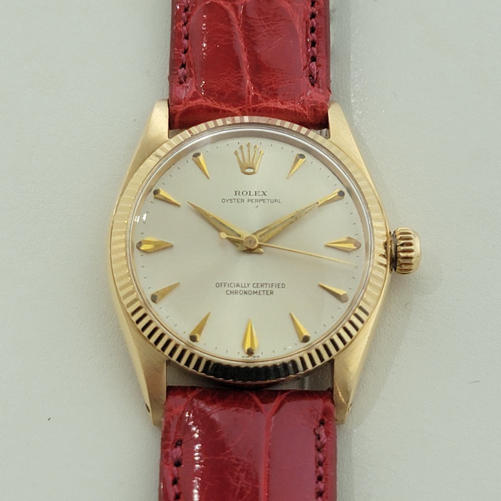 Timeless luxury, 18k solid gold Midsize Rolex Oyster Perpetual Ref.6551 automatic dress watch, c.1958, in excellent working condition. Verified authentic by a master watchmaker. Gorgeous Rolex signed dial, applied dagger index hour markers, gilt