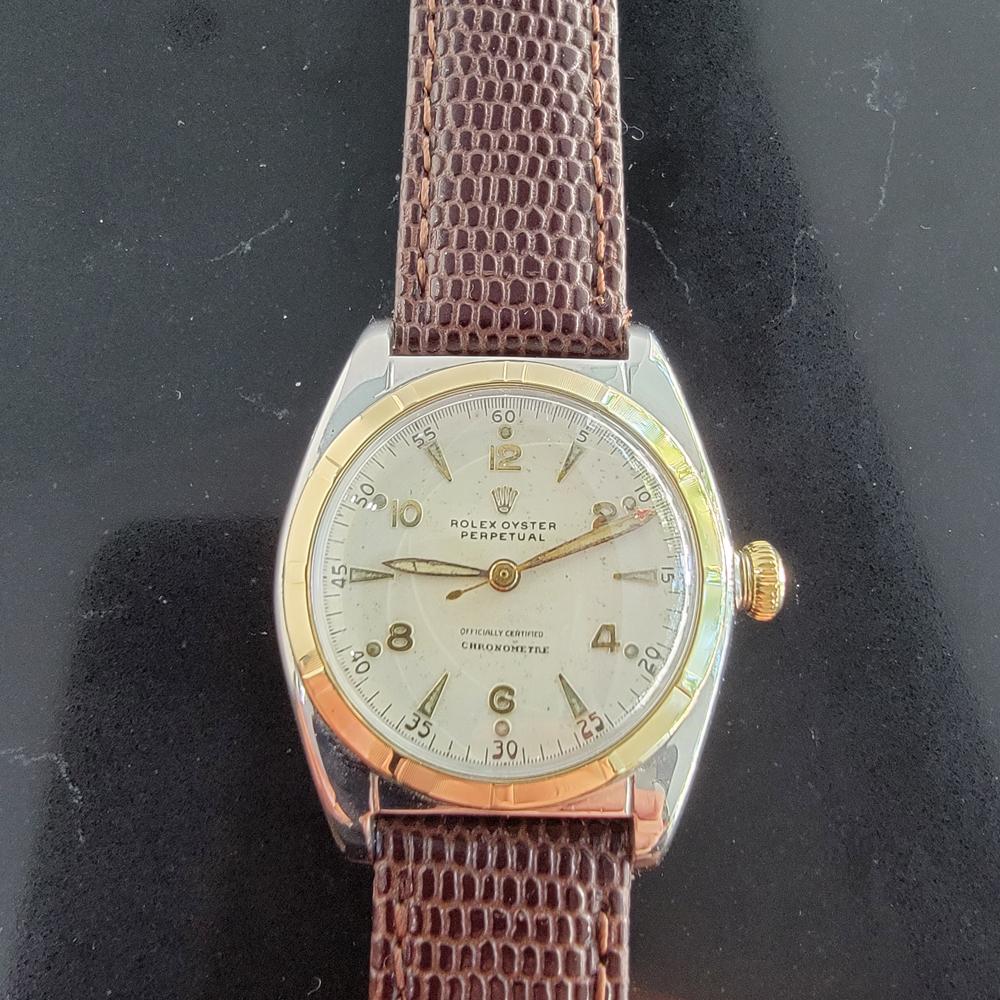 Classic icon, Men's midsize 14k gold & ss Rolex Oyster perpetual automatic bubble back dress watch, c.1948. Verified authentic by a master watchmaker. Gorgeous Rolex signed dial, applied alternating arrowhead and Arabic numeral hour markers, lumed