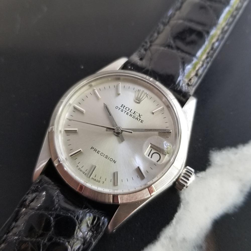 Classic icon, Men's midsize Rolex Oysterdate manual wind dress watch, c.1973. Verified authentic by a master watchmaker. Gorgeous Rolex signed silver dial, applied indice hour markers, date window at the 3 o'clock position, silver lumed minute and