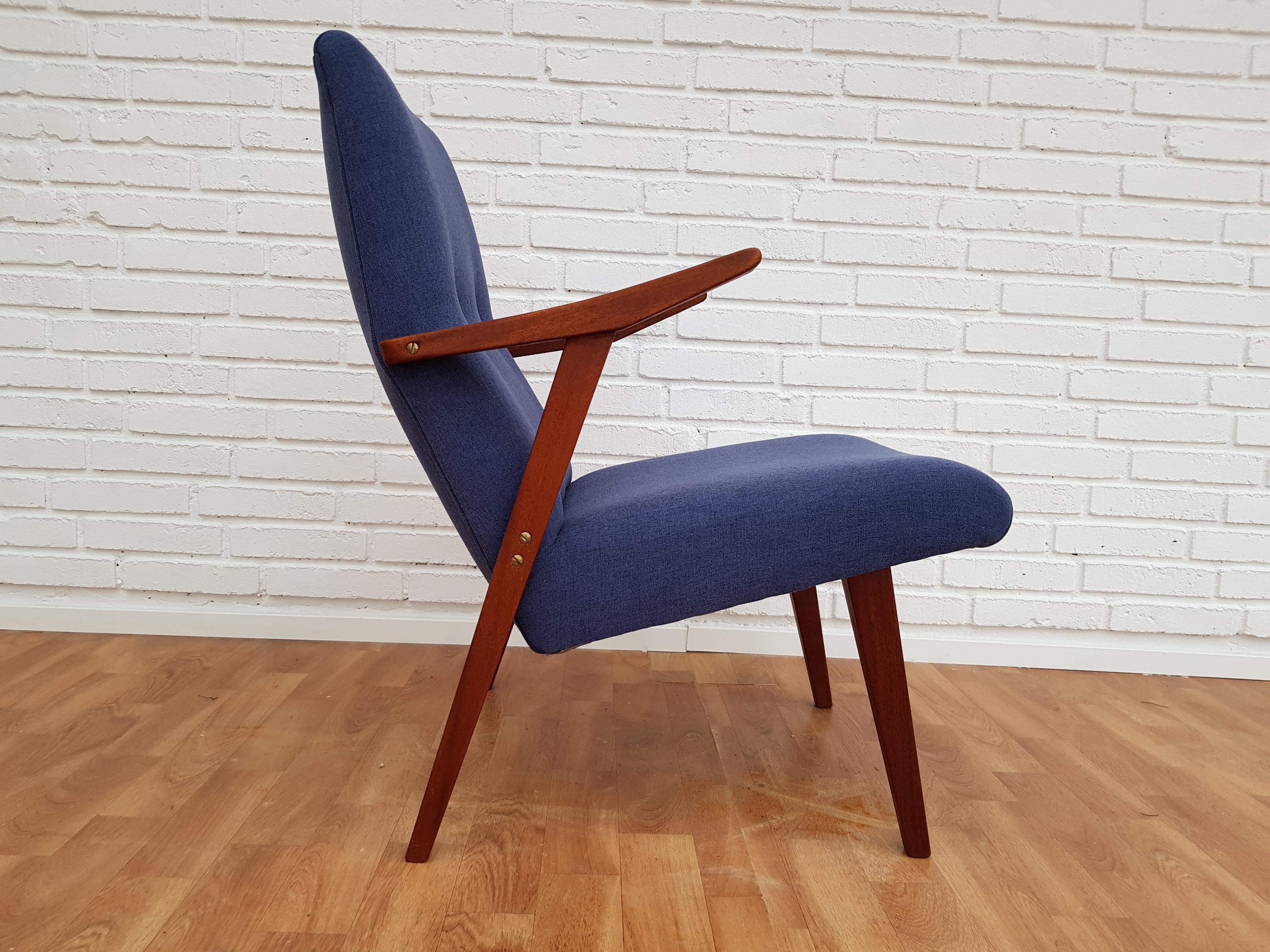 Scandinavian design, armchair. Produced in about 1960. Teakwood legs and armrests. Completely restored by craftsman, furniture upholsterer at Retro Møbler Galleri. Brand new padding with natural coconut mat. New reupholstered in quality blue