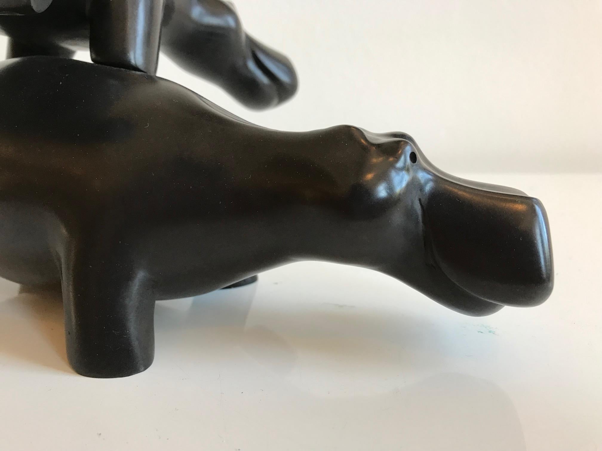''Leapfrog'', Contemporary Bronze Sculpture of Two Hippos Playing Leapfrog - Gold Figurative Sculpture by Miep Maarse