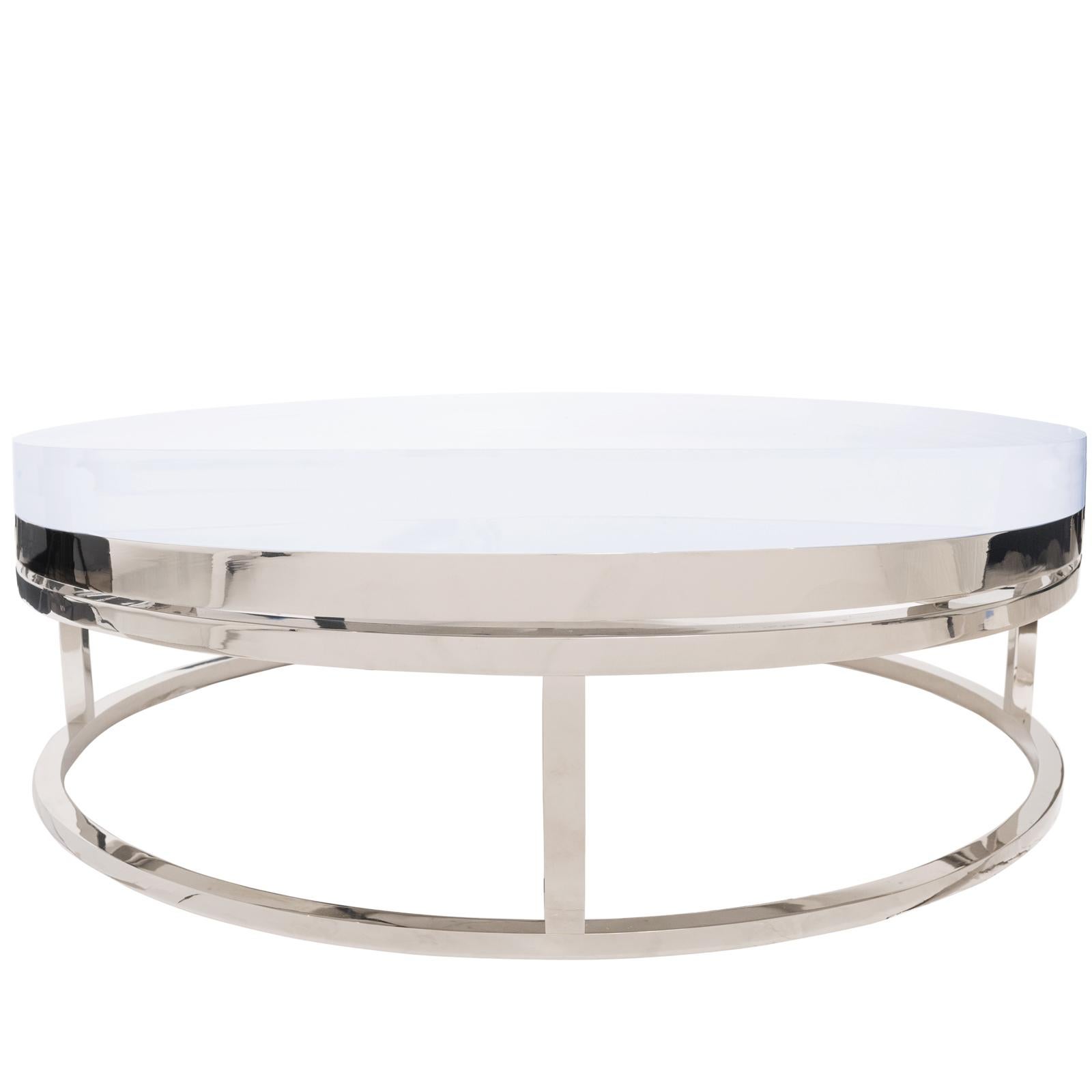 Spectacular Coffee table. Opulent base in polished Stainless steel with a pristine clear acrylic top. Available in custom sizes as well as other metal options (upon request) Ideal as a cocktail table in front of a sofa sectional!