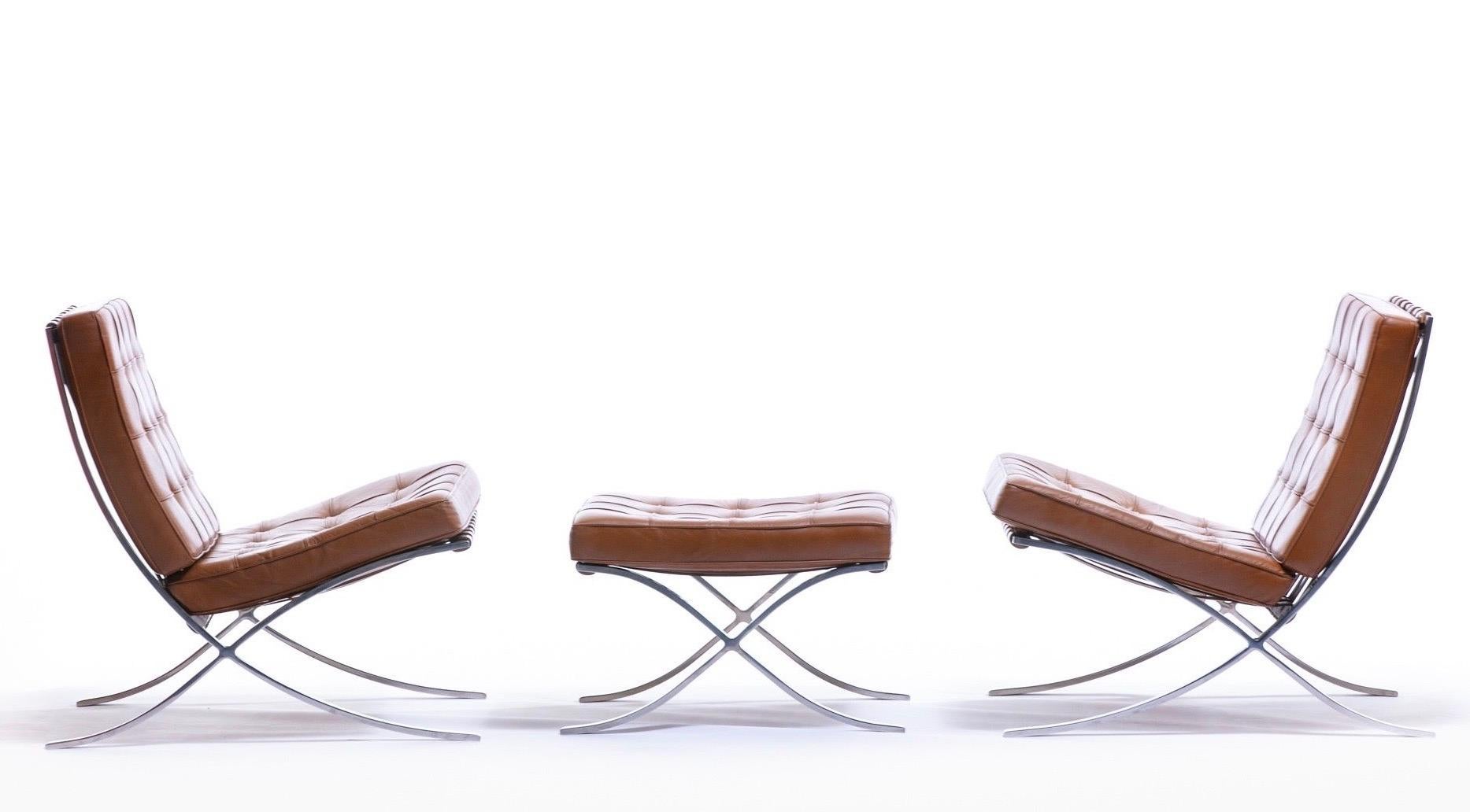A fantastic pair of labeled and authentic Barcelona lounge chairs and single Barcelona ottoman by Ludwig Mies van der Rohe for Knoll International. Originally created to serve as Modernist Throne seating for the King and Queen of Spain in the German