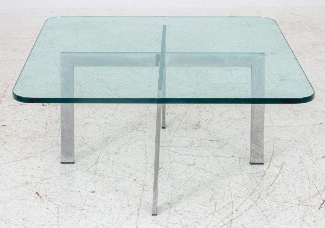 Mies van der Rohe Barcelona coffee table, chrome structure with glass top of rounded corners.