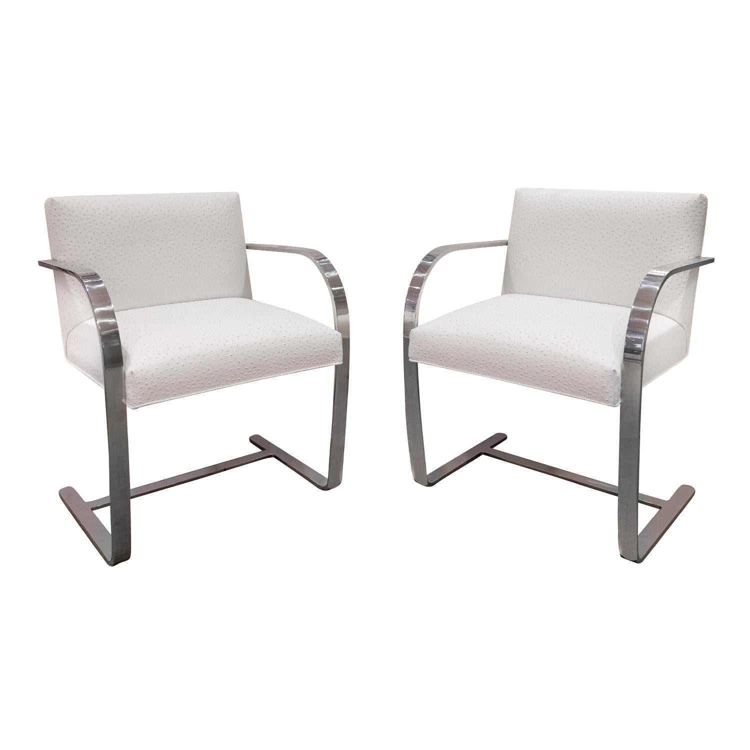 Pair of BRNO arm chairs, model 255, in polished chrome-plated flat bar steel with new white ostrich leather seats by Ludwig Mies van der Rohe for Knoll, American 1990s. These have been newly reupholstered in high quality white ostrich embossed