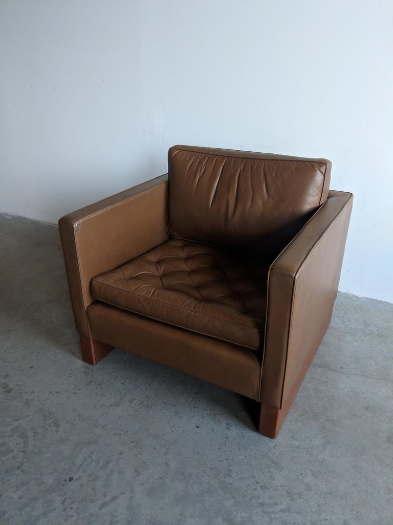 Lounge chair designed by Mies van der Rohe for Knoll, circa 1968. We bought this from an architect who trained with Louis Kahn, and purchased it new in 1974. We would describe the color as a medium brown. The sled bases are oiled walnut. Retains