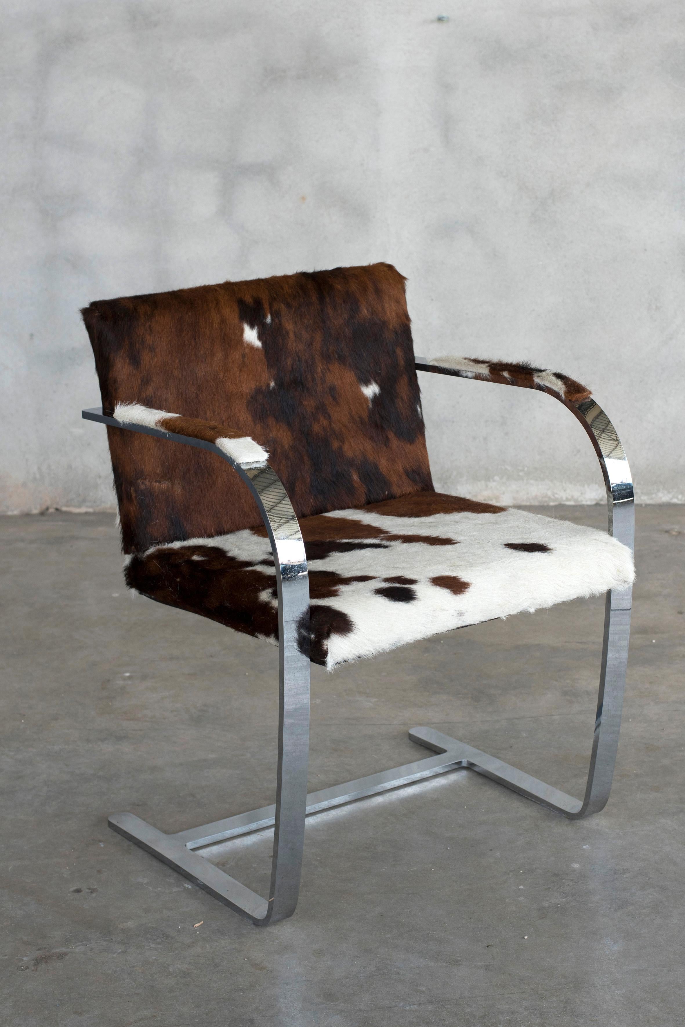Mies van der Rohe chromed steel Knoll Int. Cow fur brno chair. Two available. Price per chair.
This chair has been recently reupholstered in cow fur. Labelled with a tag of Knoll International 
Size: W 22.75