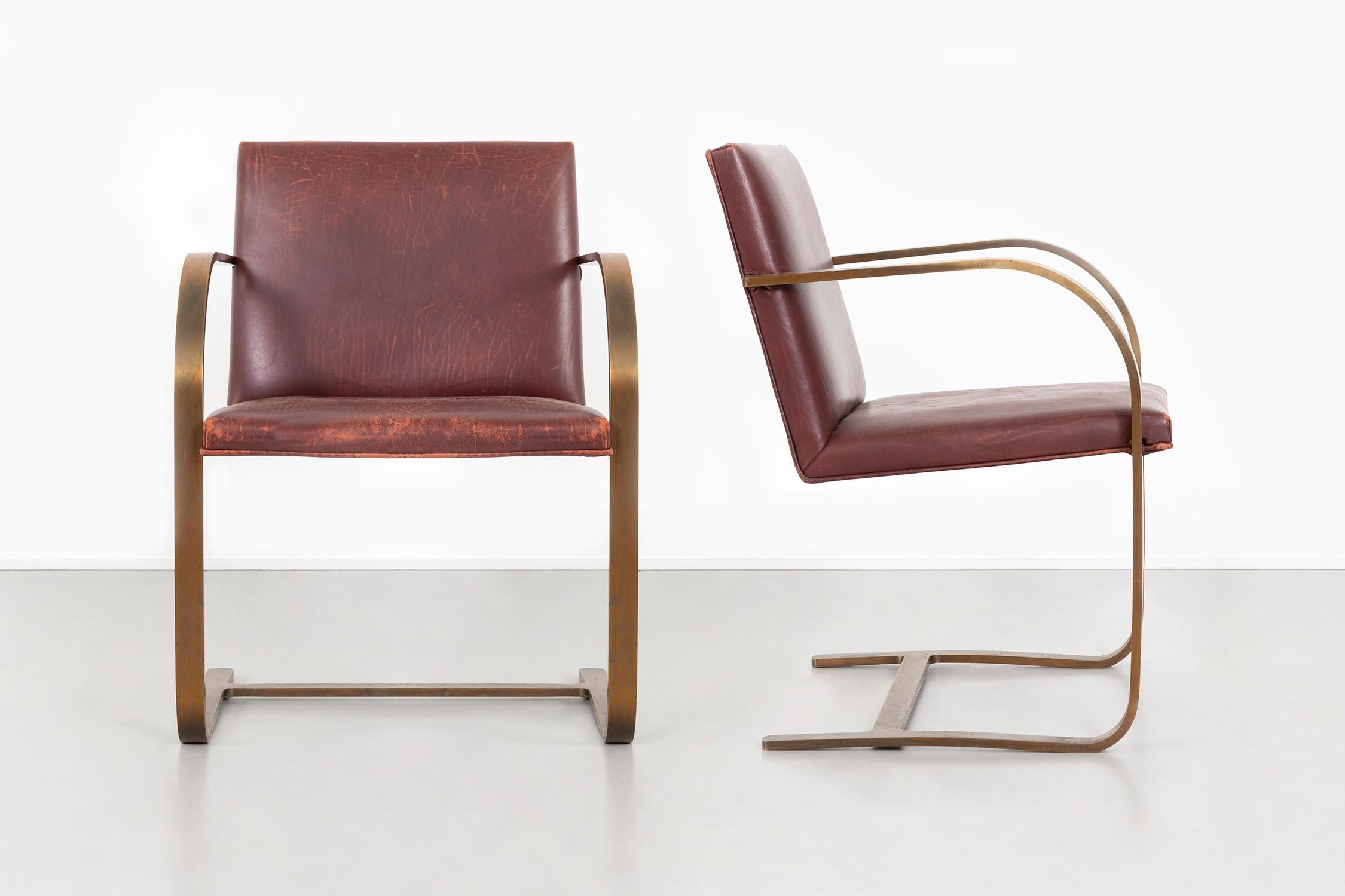 set of two bronze flat bar Brno chairs

designed by Ludwig Mies van der Rohe for Brueton

USA, d 1930 / c 1970

leather + brass

measures: 30 ½” H x 23“ W x 22“ D x seat 17“ H

sold as a set or individually.

manufacturer’s label located under