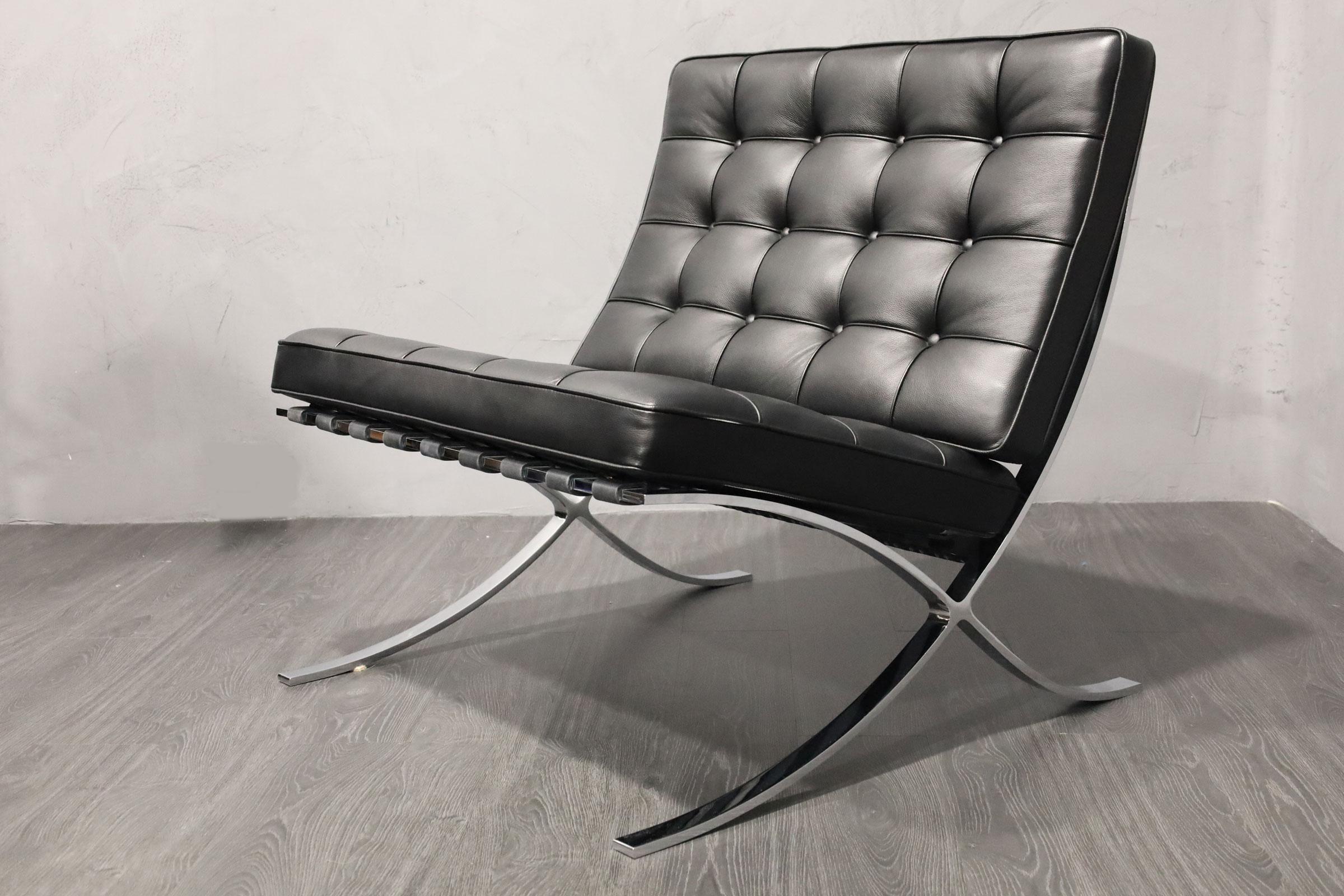 Mies van der Rohe's iconic Barcelona chair with stool. Stamped Knoll.