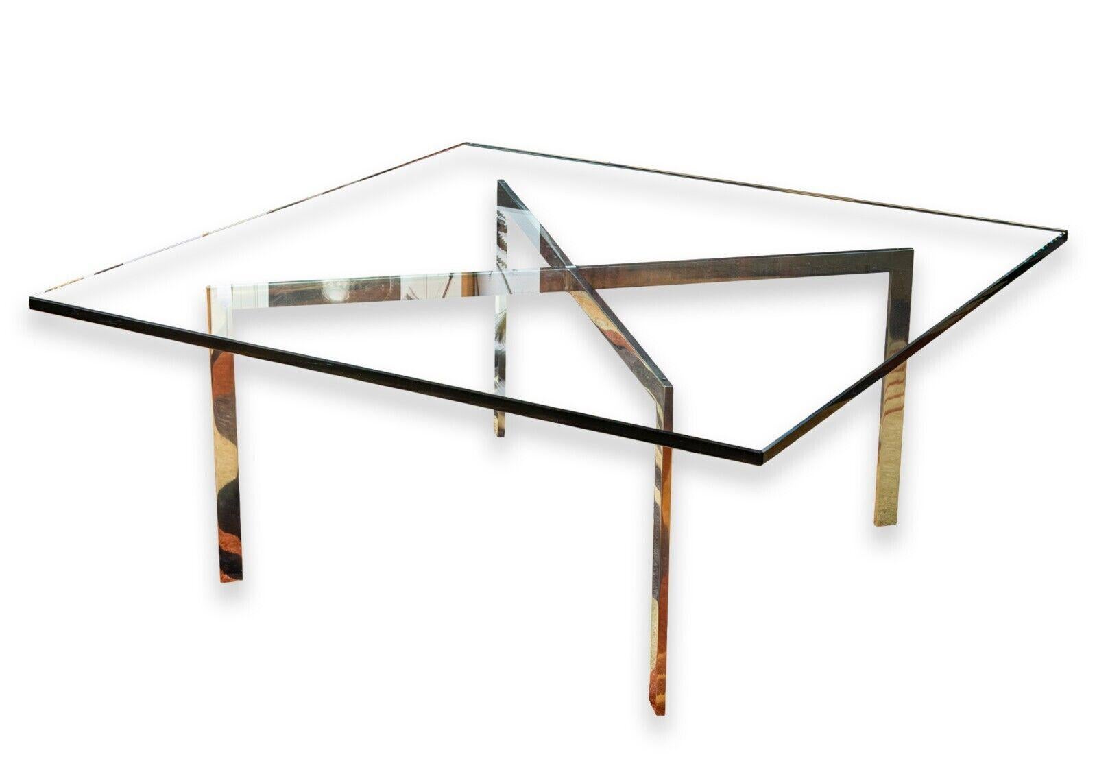 A Mies van der Rohe for Knoll Barcelona coffee table. An extremely iconic coffee table for your extremely iconic home. A piece of functional artwork, simple yet sculptural. This modern coffee table features a thick square glass table top, and chrome