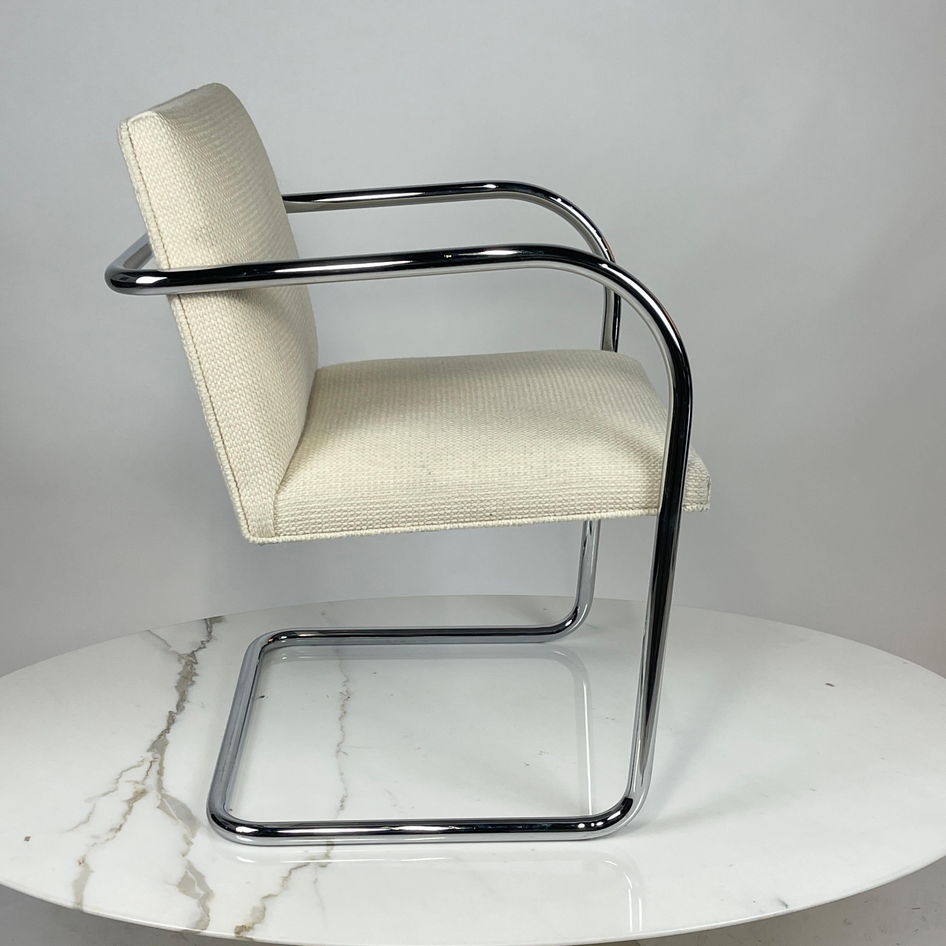 Knoll Brno chair designed by Mies Van der Rohe. These chairs are upholstered in Knoll's Cato upholstery. Color is 'natural'- which reads as a pale oatmeal color. These chairs are from 2018 so in very nice condition. 
Priced per chair. Approximately
