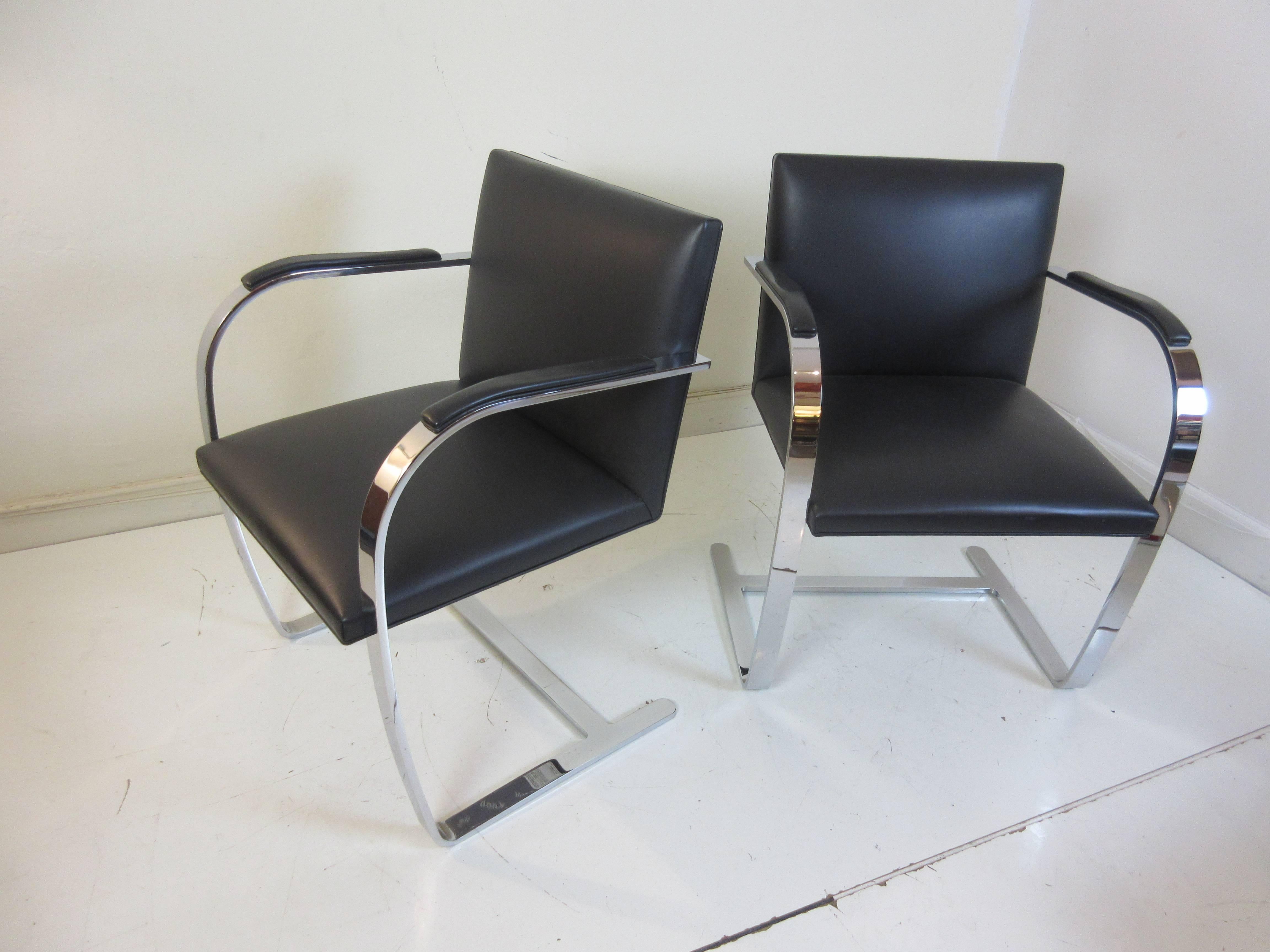 Mies van der Rohe for Knoll chair in leather with arm pads and flat banded triple plated chrome frames. Never used and perfect. Dated 2002 on Knoll production tags. Mies name etched in chrome.