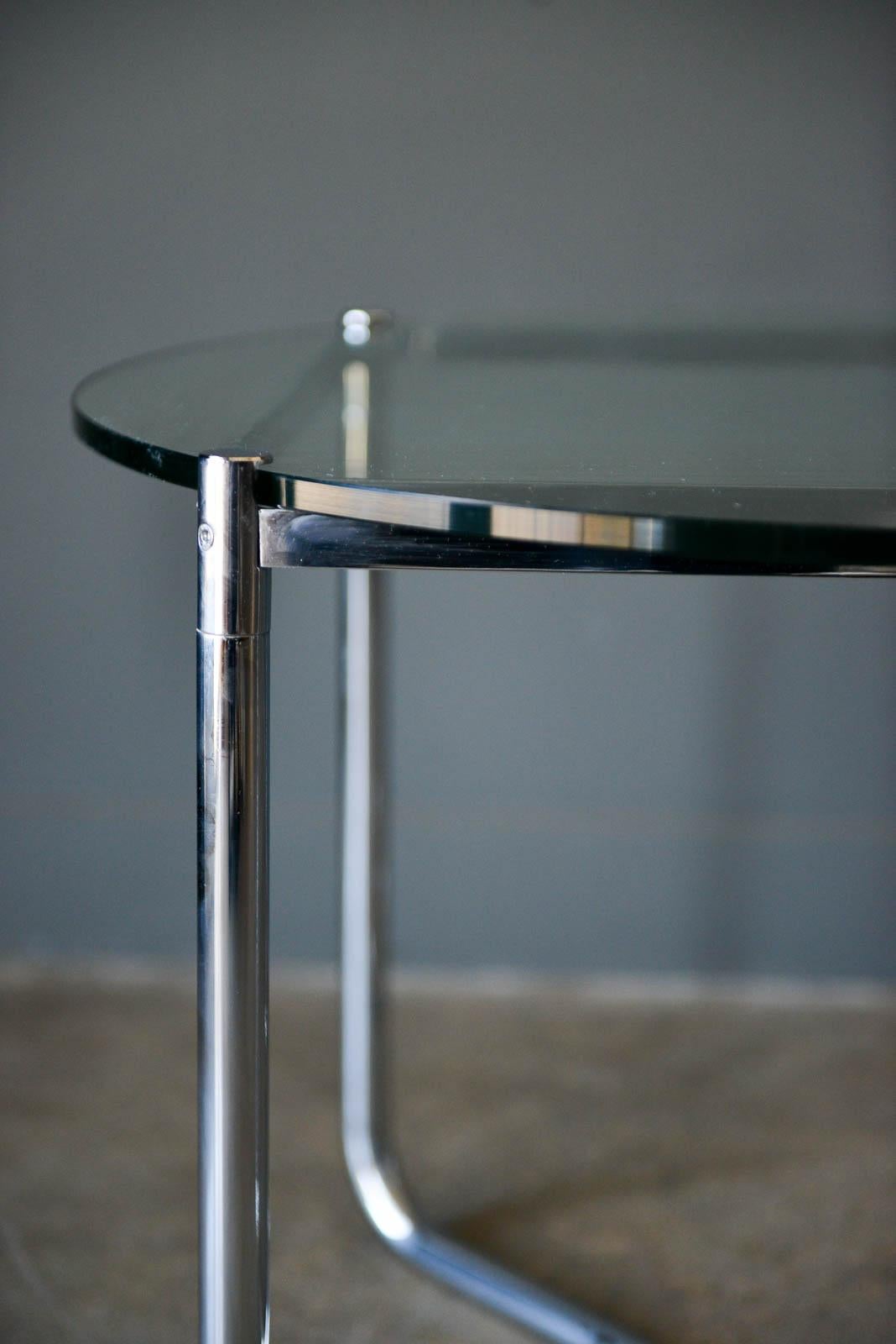 Mies van der Rohe for Knoll chrome and glass side table, circa 1975. Very good original condition with shiny polished chrome-plated steel. Glass has minor wear as shown.

Measures: 27